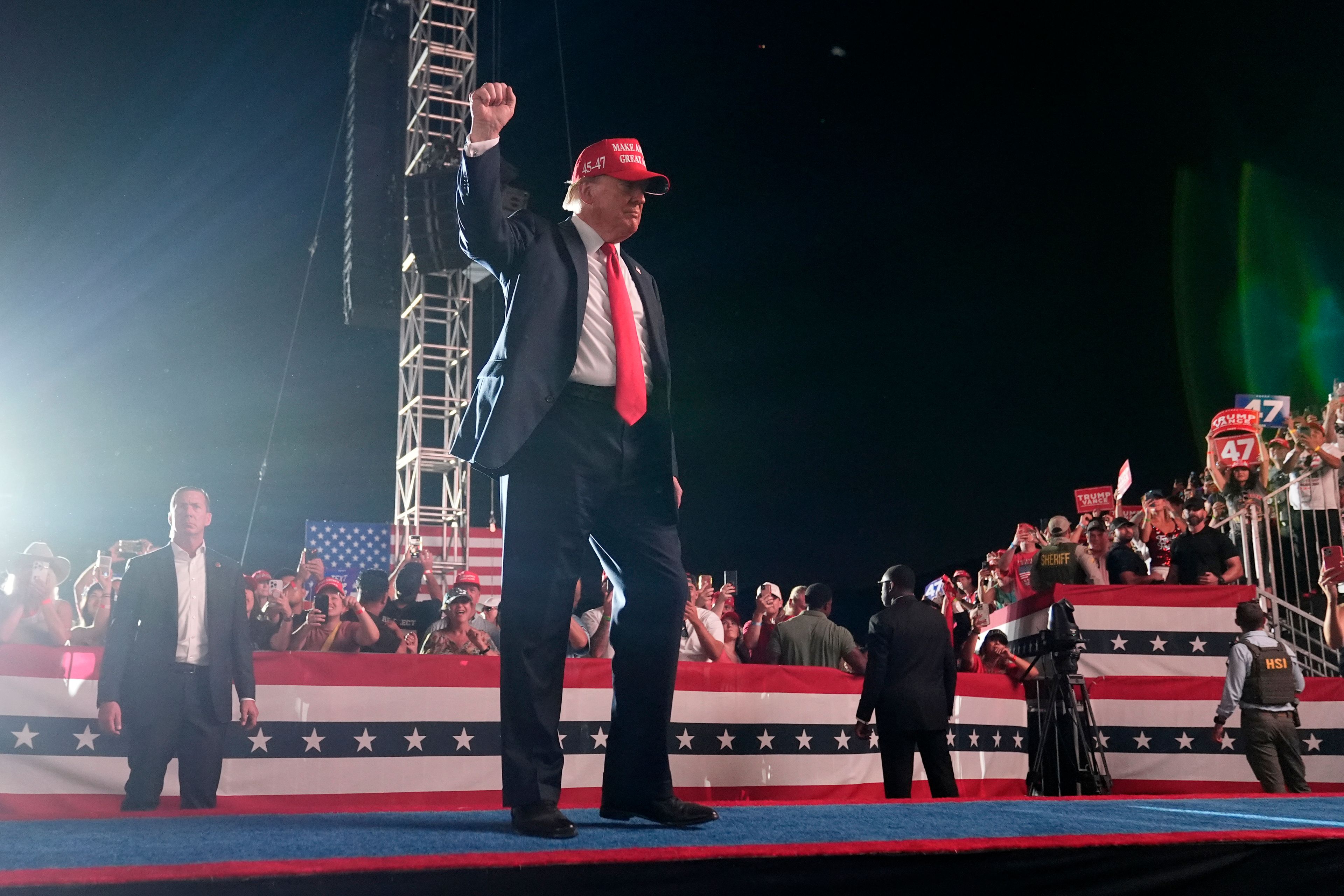 Republican presidential nominee former President Donald Trump gestures to the audience as he departs a campaign rally at the Calhoun Ranch, Saturday, Oct. 12, 2024, in Coachella, Calif. (AP Photo/Alex Brandon)