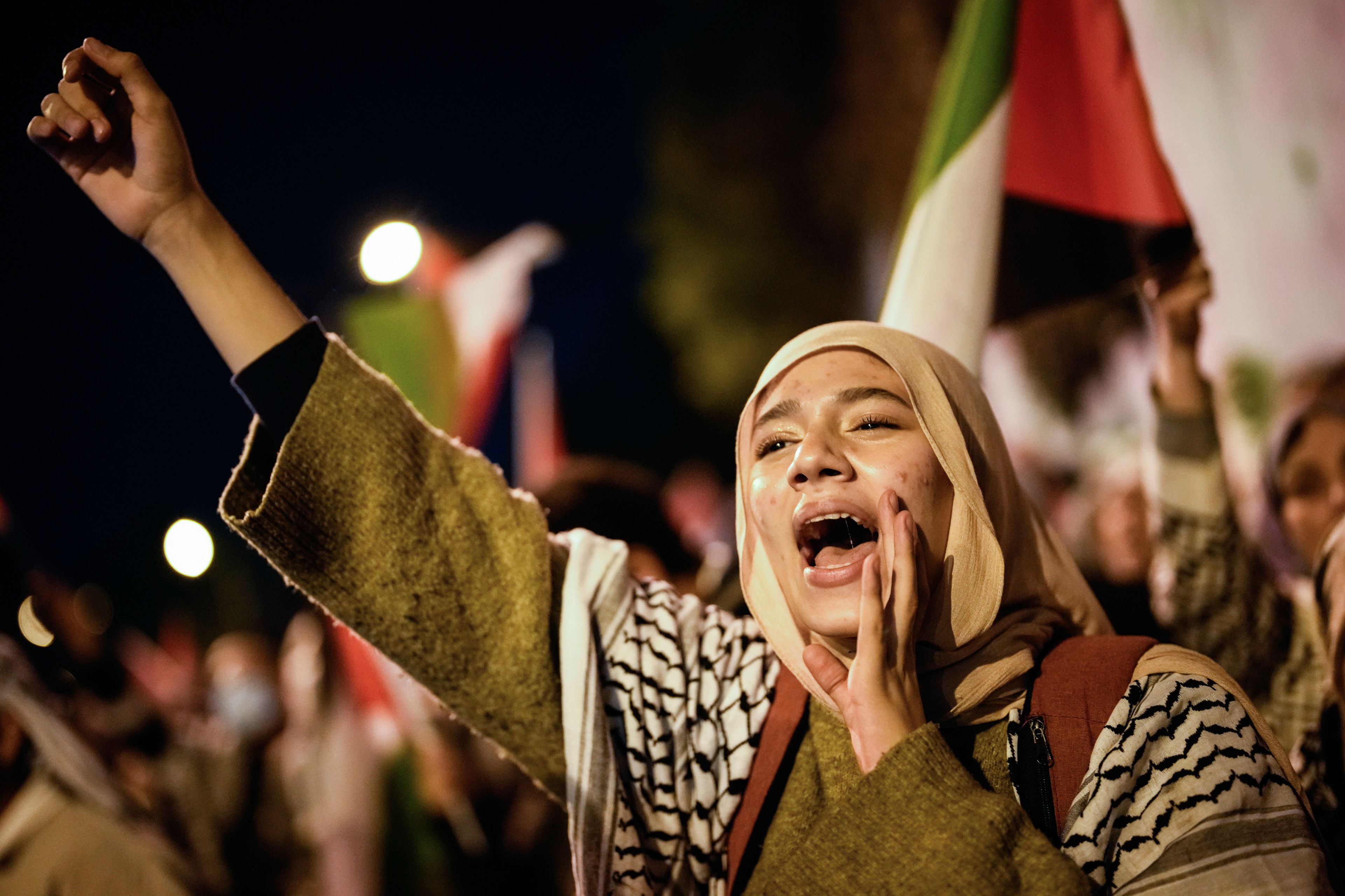 A woman chants slogans during a pro-Palestinian protest next to the U.S. Consulate in Istanbul, Turkey, Friday, Oct. 25, 2024. (AP Photo/Emrah Gurel)