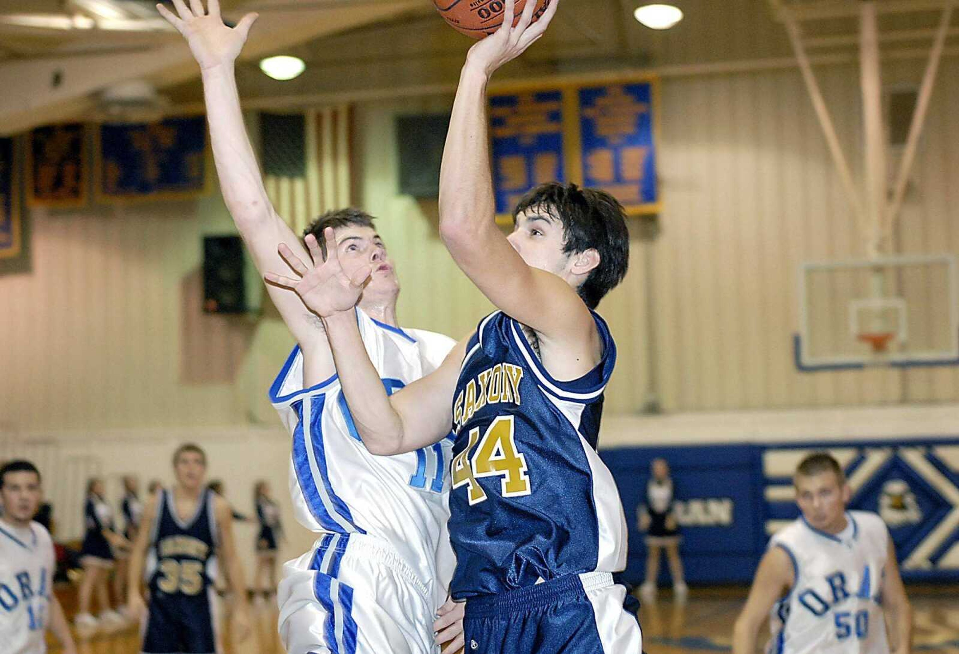 Oran defender Kurt Rendleman, left, rejected a shot by Saxony Lutheran forward Ben Courtois during their game Thursday night in Oran. (Kit Doyle)