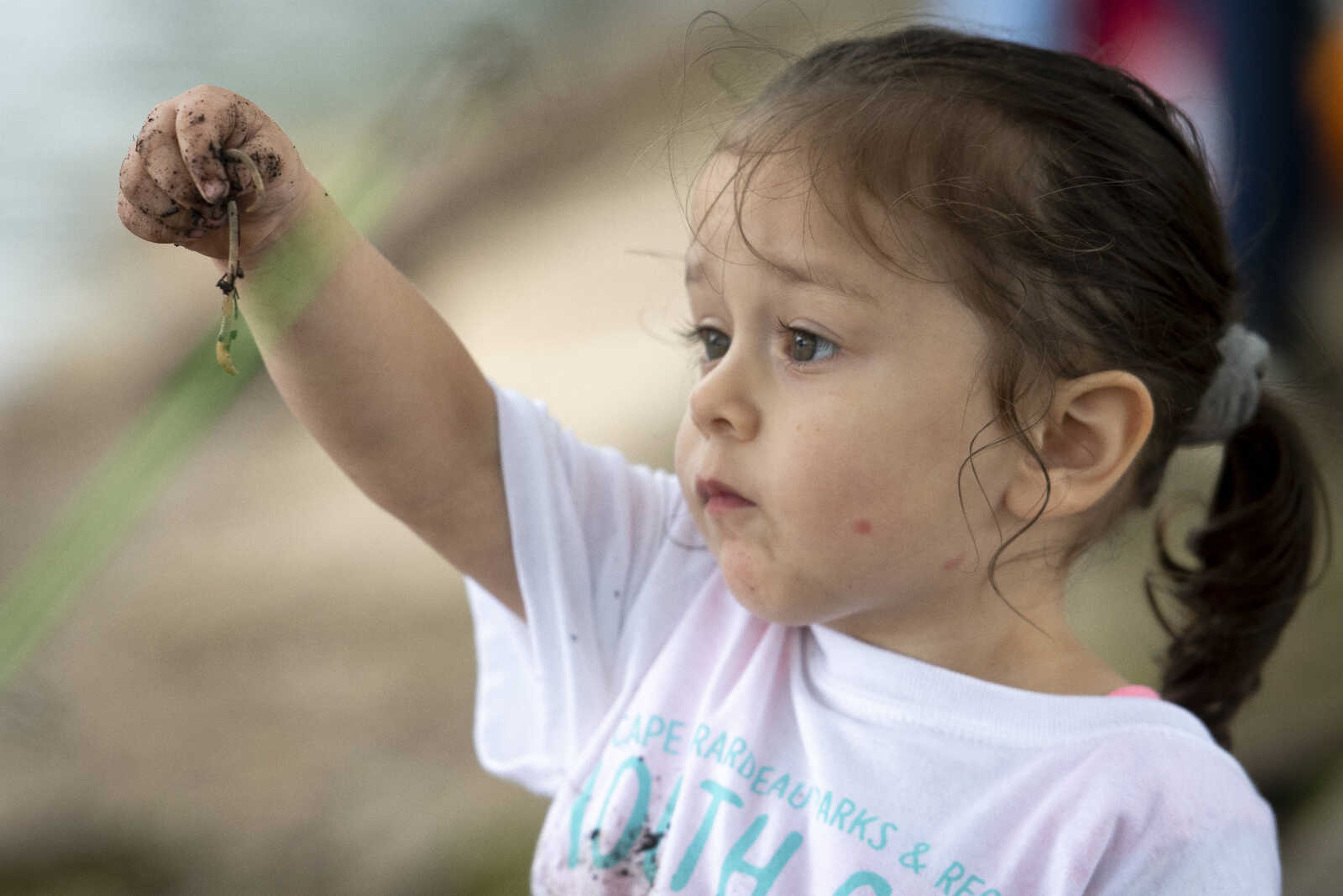 Gracie Salazar, 2, of Cape Girardeau, holds a worm during a Youth Catch & Release fishing event Saturday, June 8, 2019, at Capaha Park in Cape Girardeau. "This is the first time my two's been fishing," Gracie's mother Lacy Salazar said. "First time they caught a fish." The event was hosted by Cape Girardeau Parks & Recreation and the Cape Girardeau Jaycees.