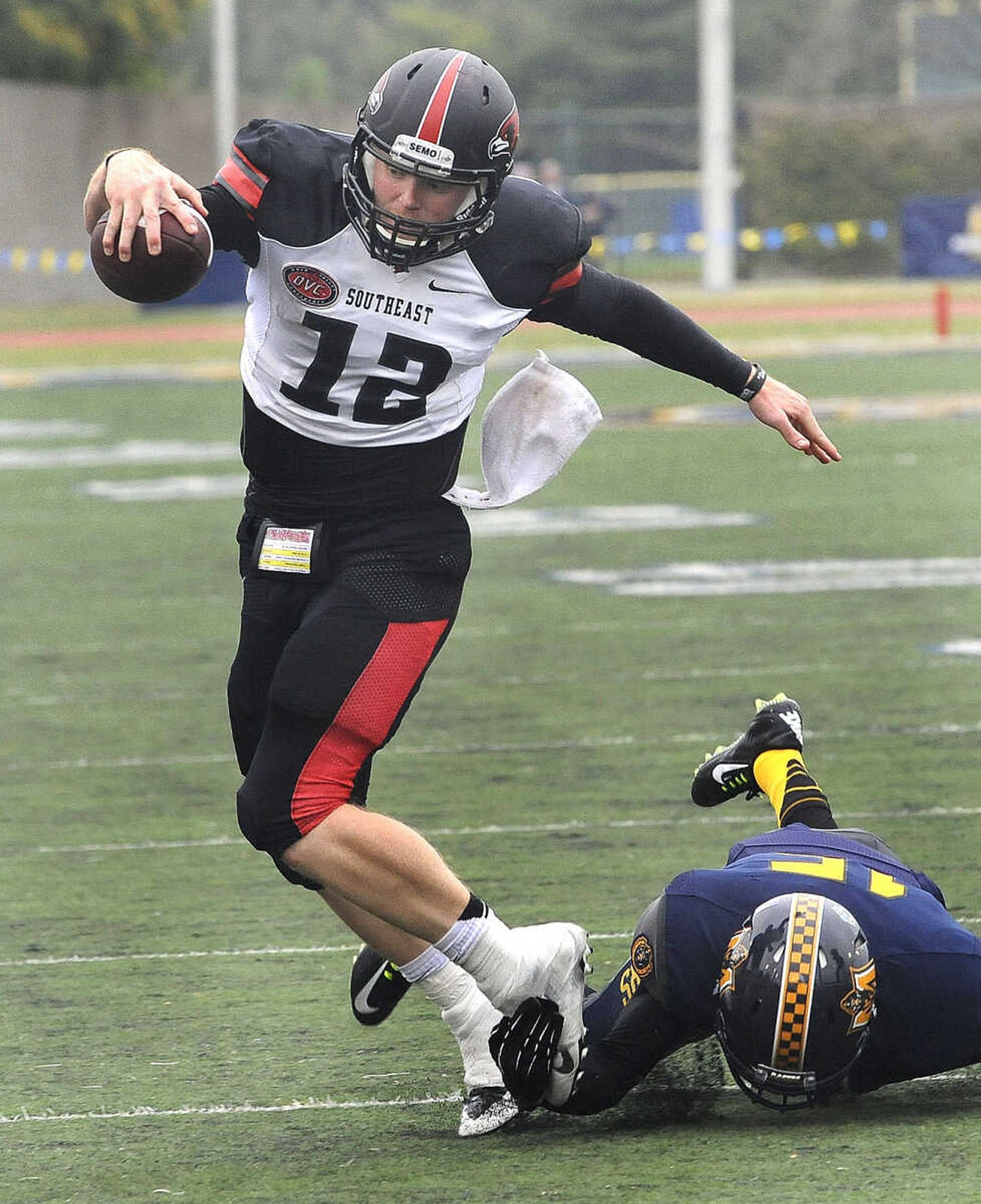 Southeast Missouri State quarterback Kyle Snyder carries before he is brought down by Murray State's DeQuinten Spraggins during the third quarter Saturday, Oct. 11, 2014 in Murray, Kentucky. (Fred Lynch)