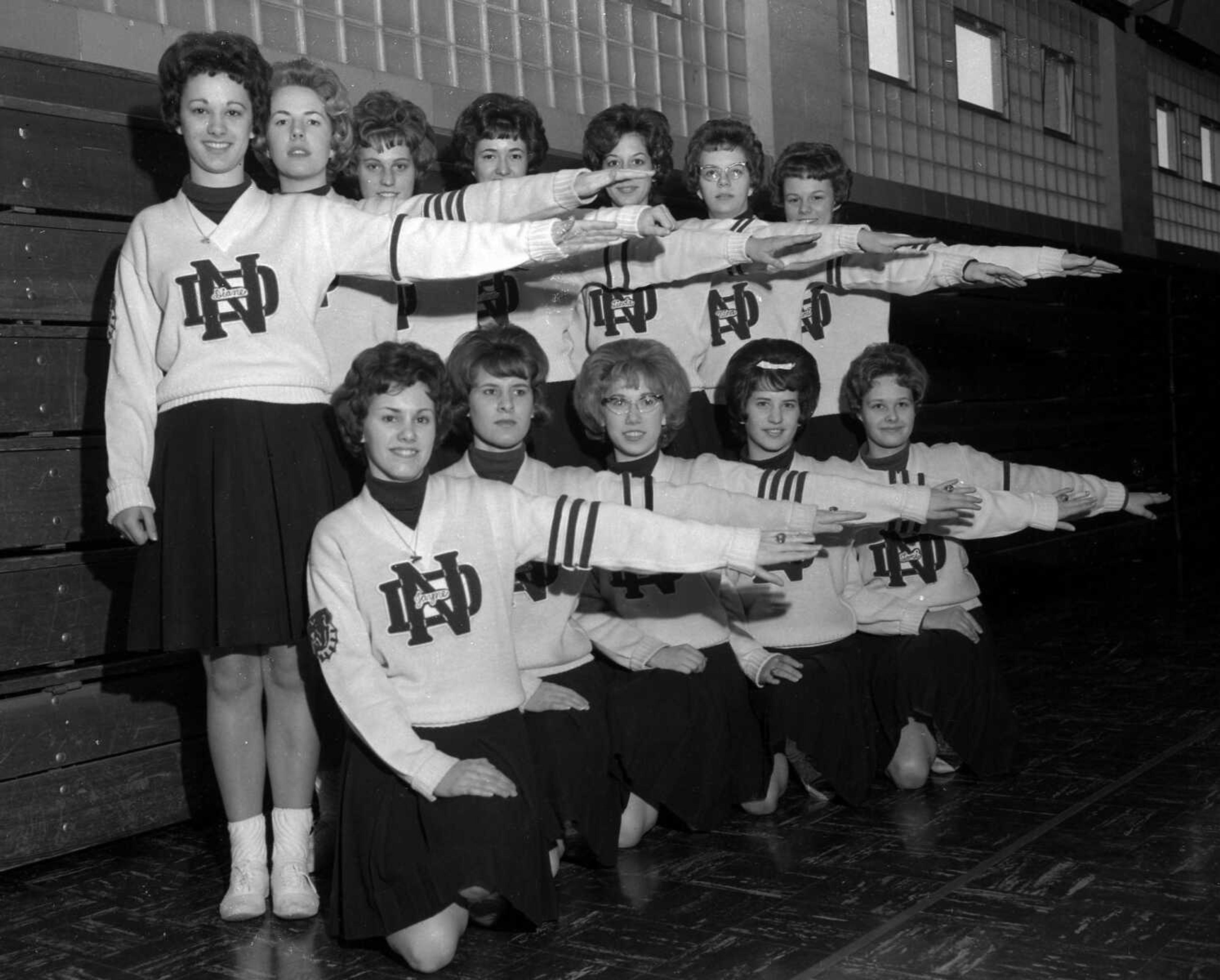 Feb. 28, 1963 Southeast Missourian.
An even dozen lassies make up the cheerleaders’ A team at Notre Dame High School. Leading their student body in pep and yells through the basketball season just ending were these girls, left, front: Jane Patrick, Barbara Rafferty, Pat Meyers, Sharon Braun and Lorelei Schwartz. Standing: Diane Merideth, Kathy Casey, Mary Campbell, Joann Fornkohl,  Linda Sides, Virginia Glastetter and Cheri Jones. (G.D. Fronabarger/Southeast Missourian archive)