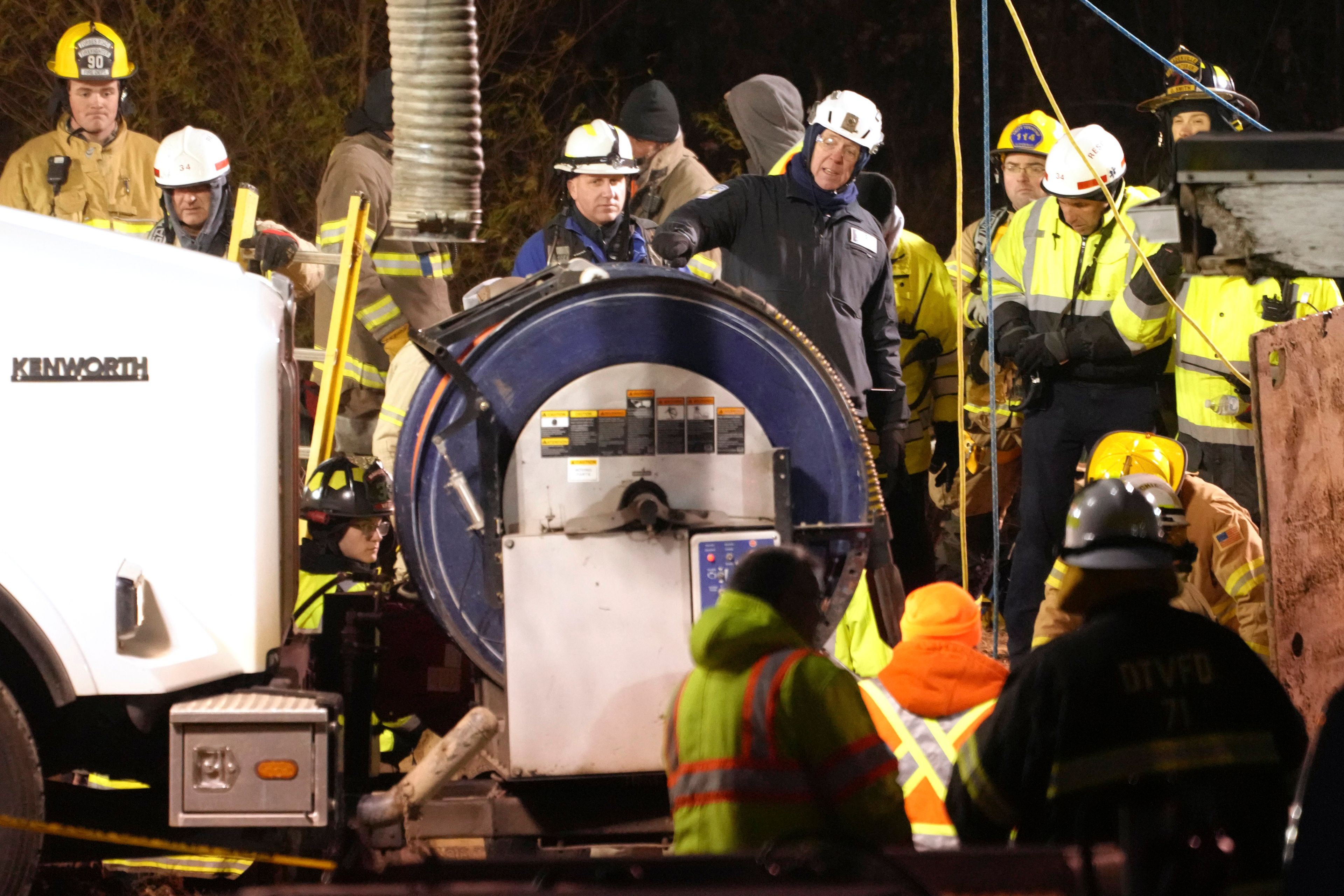 Rescue workers search in a sinkhole for Elizabeth Pollard, who disappeared while looking for her cat, in Marguerite, Pa., Tuesday, Dec. 3, 2024. (AP Photo/Gene J. Puskar)