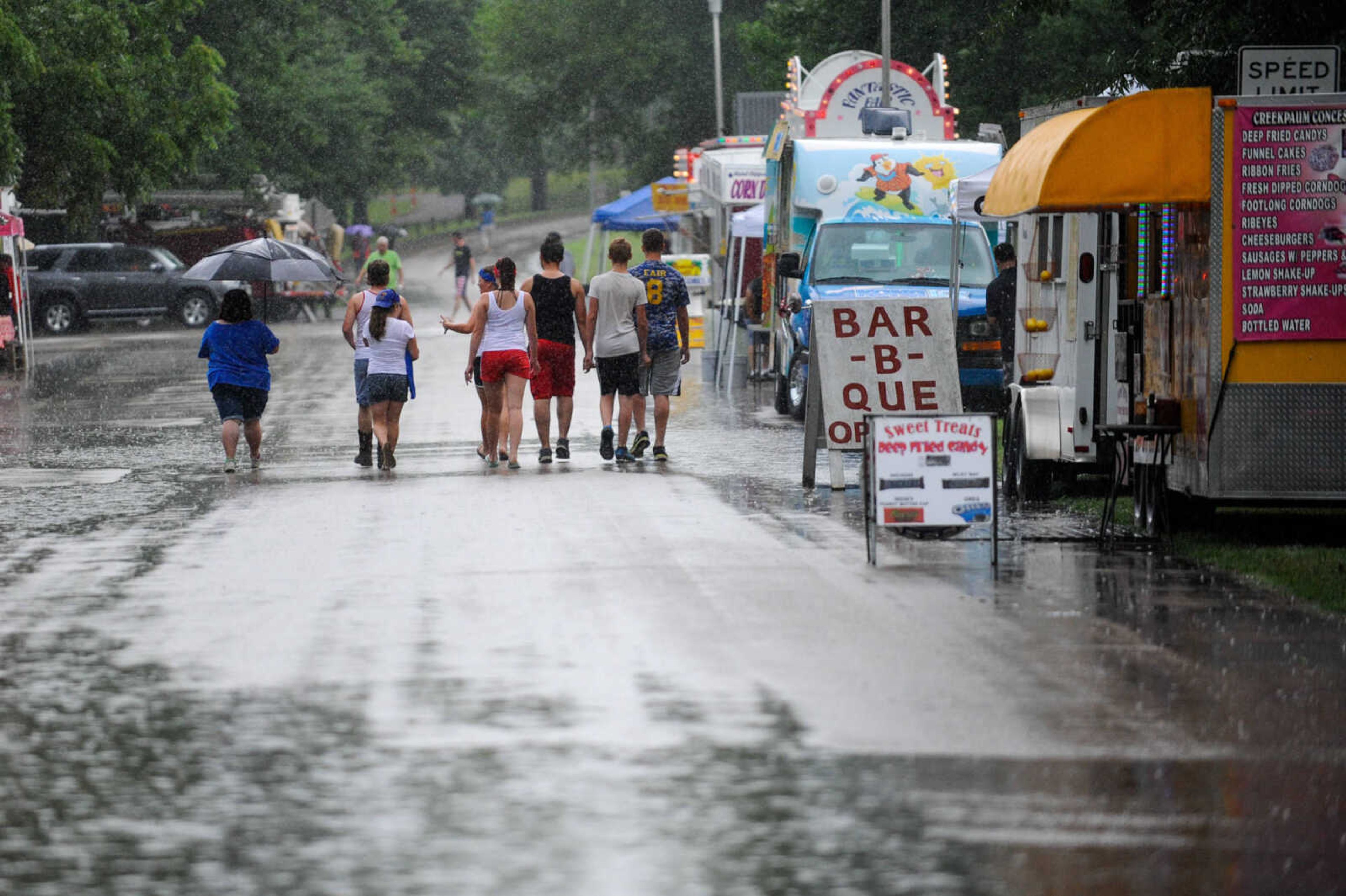 GLENN LANDBERG ~ glandberg@semissourian.com

Crowds brave the rain for the Jackson Fourth of July celebration Monday, July 4, 2016 at Jackson City Park.