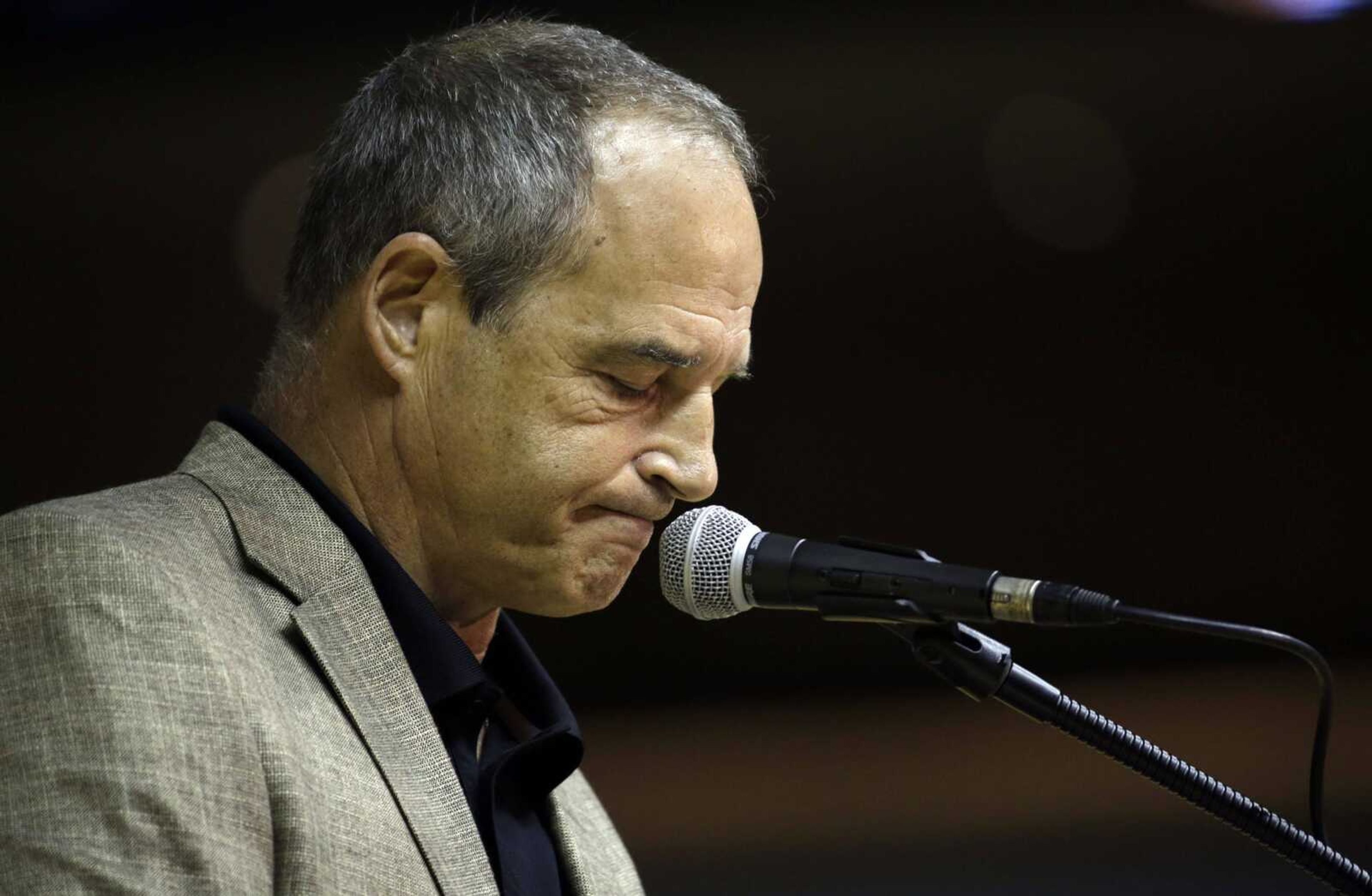 Missouri coach Gary Pinkel pauses while speaking during a news conference Monday in Columbia, Missouri. Pinkel has announced he will resign following the 2015 season after being diagnosed with lymphoma in May. (Jeff Roberson ~ Associated Press)