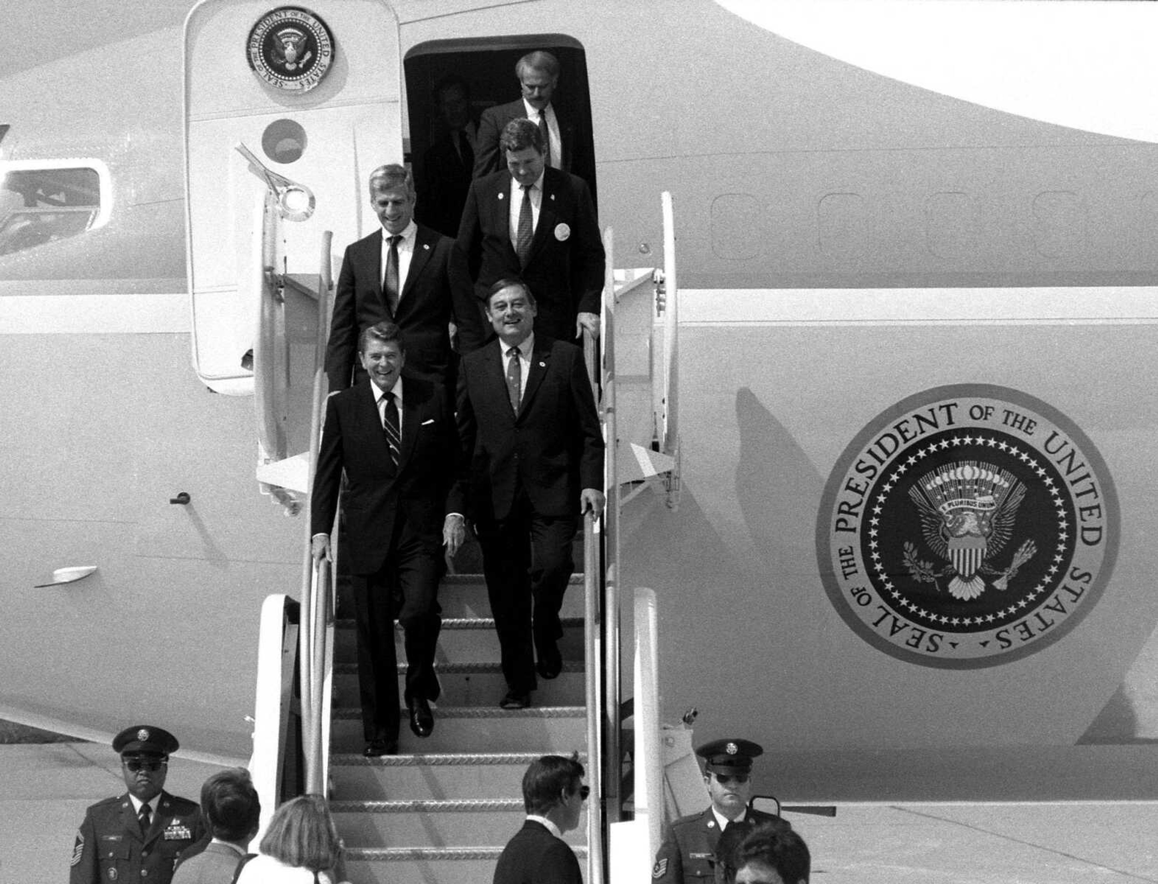 President Ronald Reagan arrives in Cape Girardeau aboard Air Force One on Sept. 14, 1988. Coming off the plane with the president at Cape Girardeau Municipal Airport are U.S. Rep. Bill Emerson of Cape Girardeau, front right; U.S. Sen. John Danforth, rear left; and U.S. Sen. Kit Bond, rear right. (FRED LYNCH ~ flynchsemissourian.com)