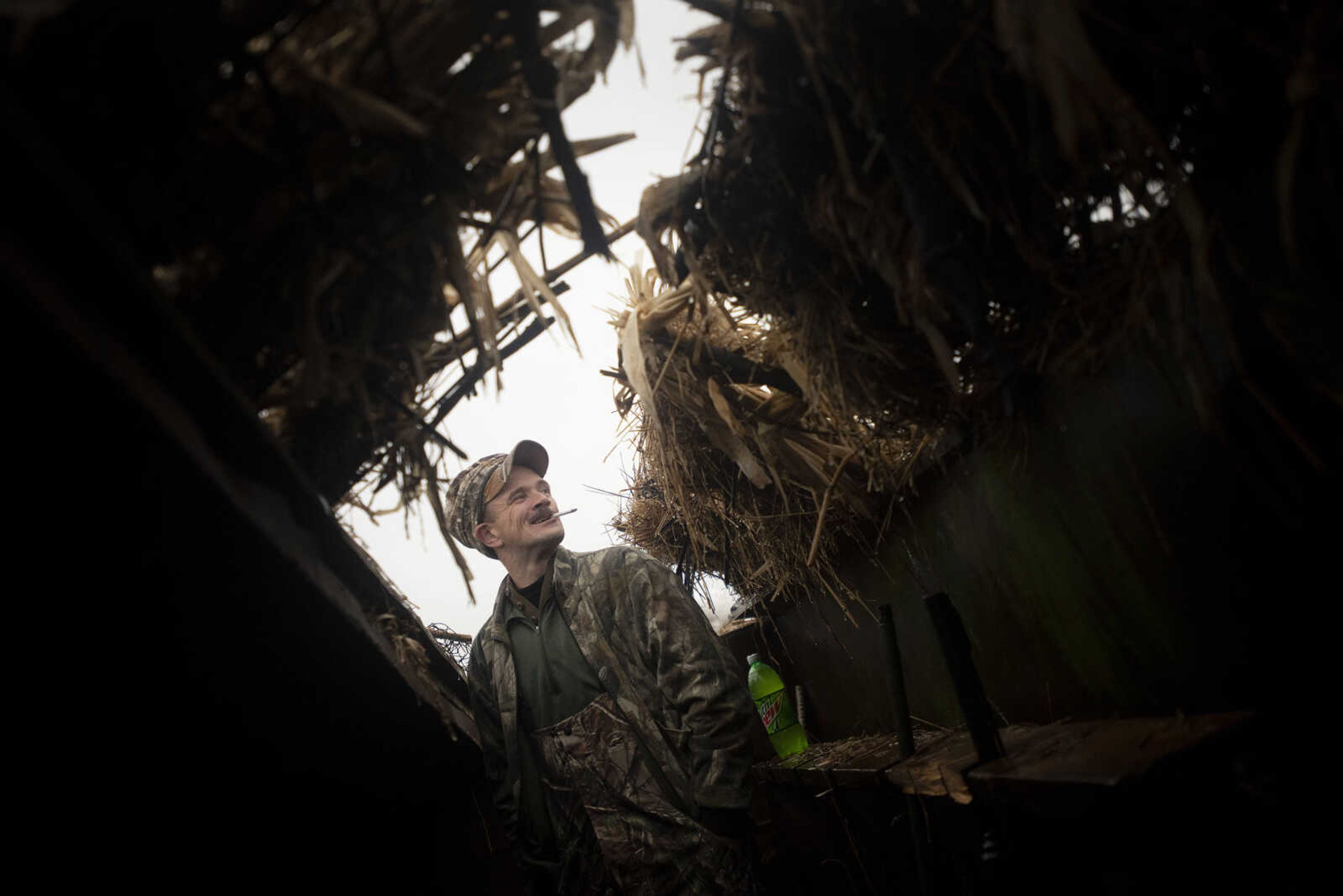 Active duty Air Force member Andrew Shanahorn, originally of Columbus, Ohio, and now at Scott Air Force Base, has a smoke during a snow geese hunt Saturday, March 14, 2020, in Ware, Illinois.