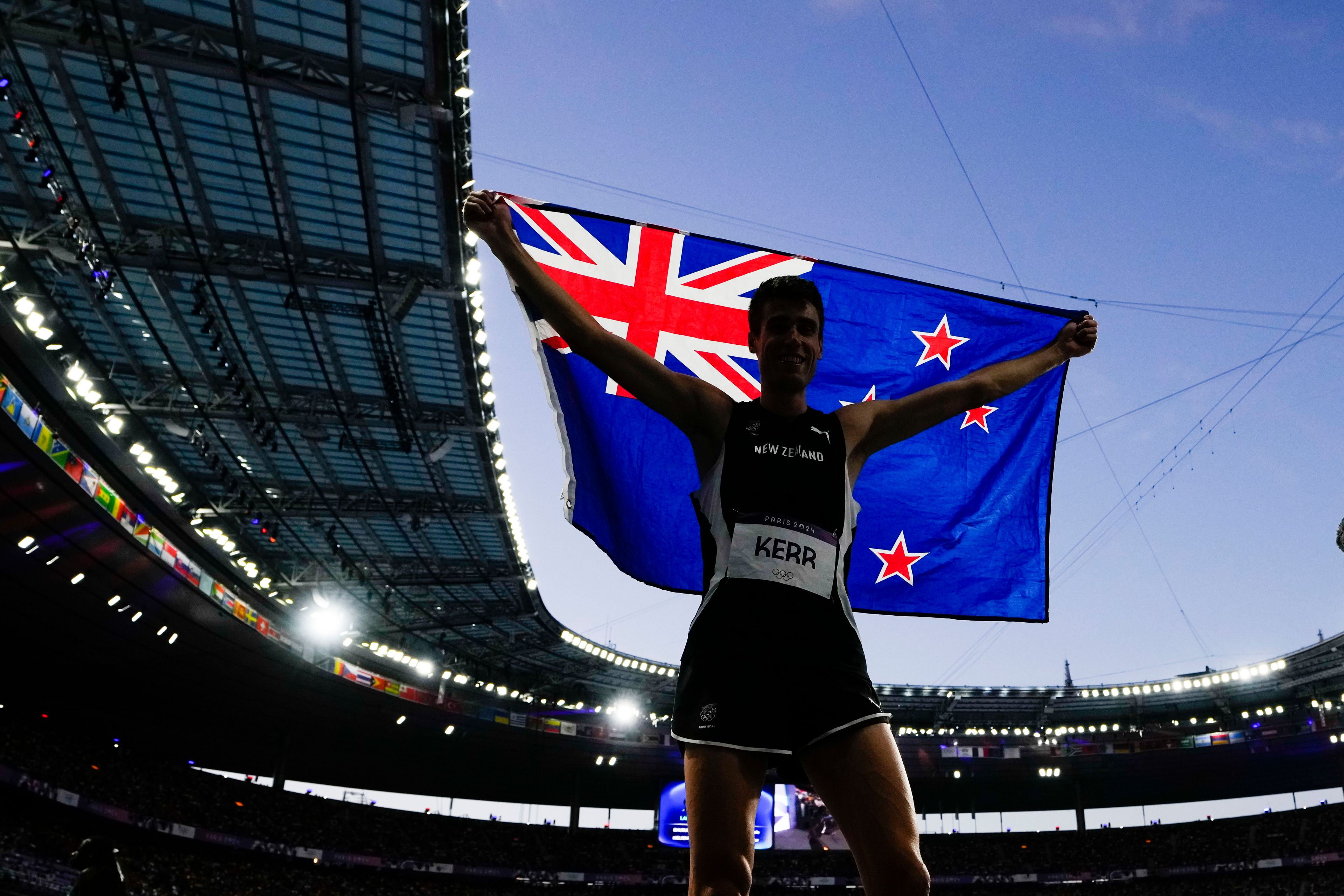 Hamish Kerr, of New Zealand, celebrates after winning the men's high jump final at the 2024 Summer Olympics, Saturday, Aug. 10, 2024, in Saint-Denis, France. (AP Photo/Petr David Josek)