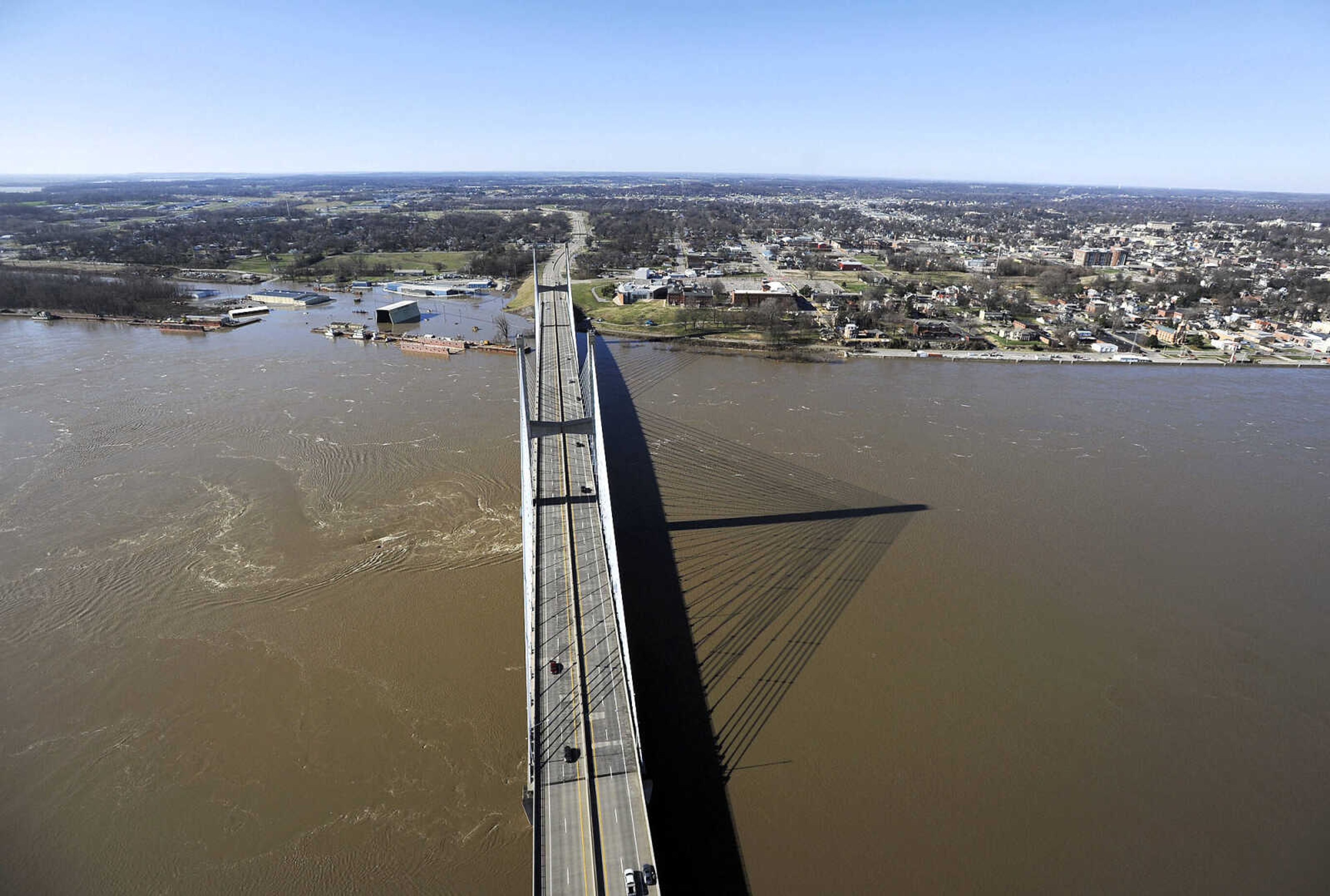 LAURA SIMON ~ lsimon@semissourian.com

The swollen Mississippi River is seen flowing under the Bill Emerson Memorial Bridge in Cape Girardeau, Saturday, Jan. 2, 2016.