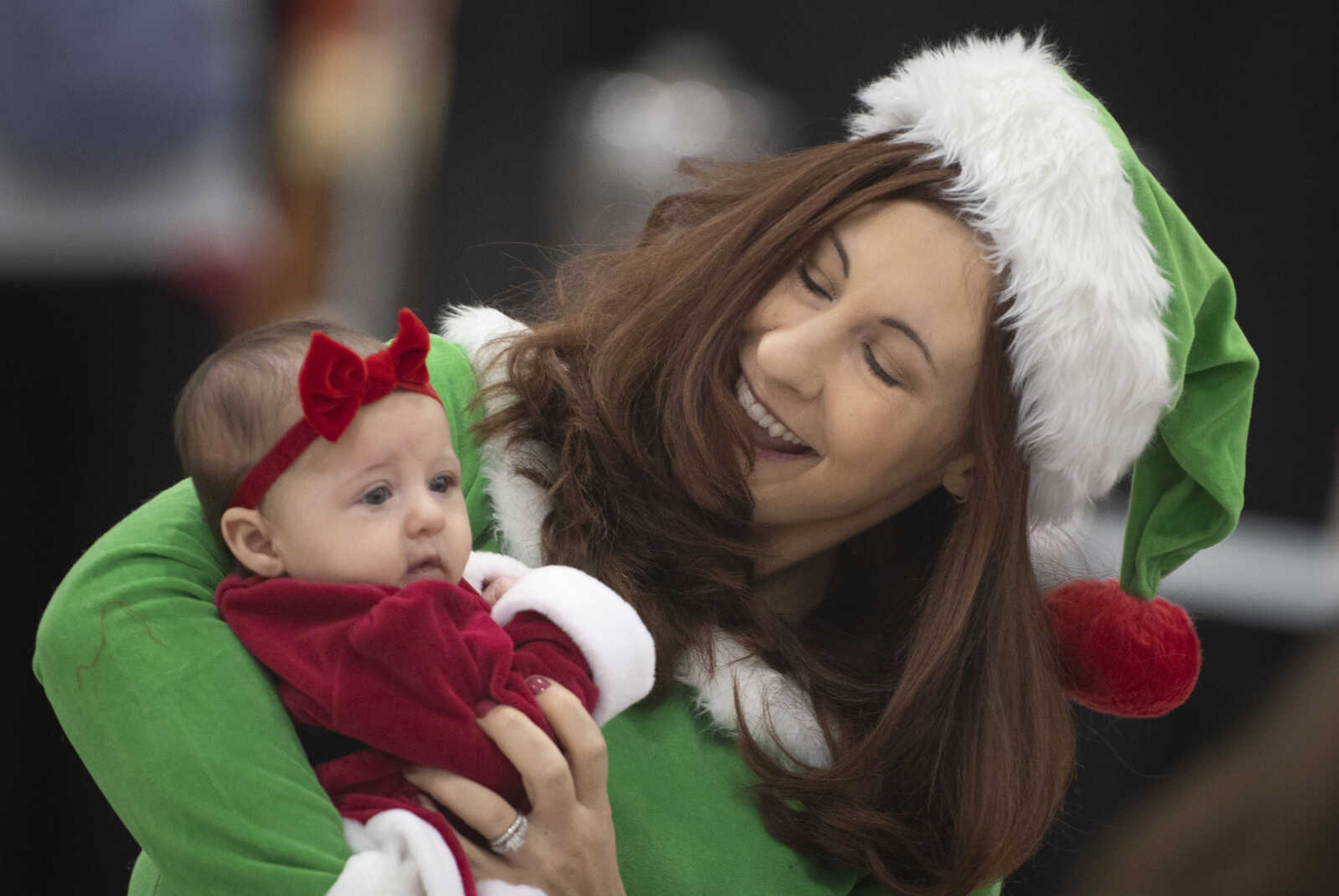 Christine Jaegers of Jackson holds her 9-week-old child Paige Jaegers during the Cape Parks &amp; Recreation Foundation's Breakfast with Santa event Saturday, Dec. 14, 2019, at the Osage Centre in Cape Girardeau.