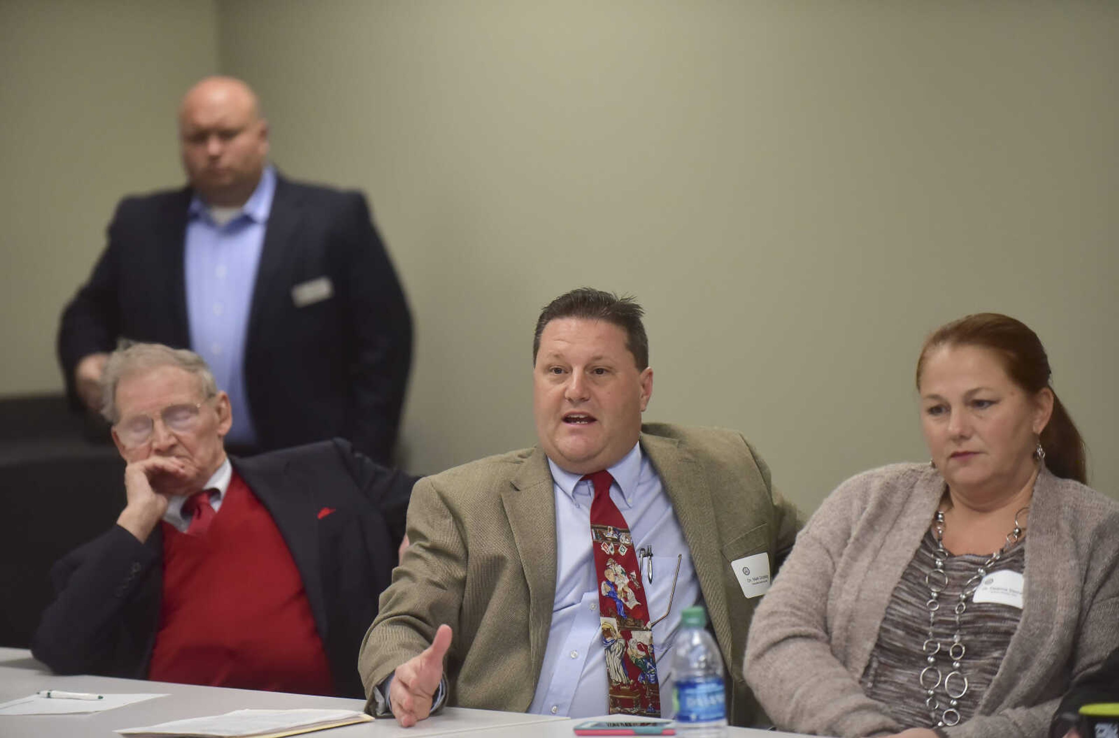 Dr. Mark Schabbing of Perryville Family Care Clinic asks a question to U.S. Rep. Jason Smith on Wednesday.