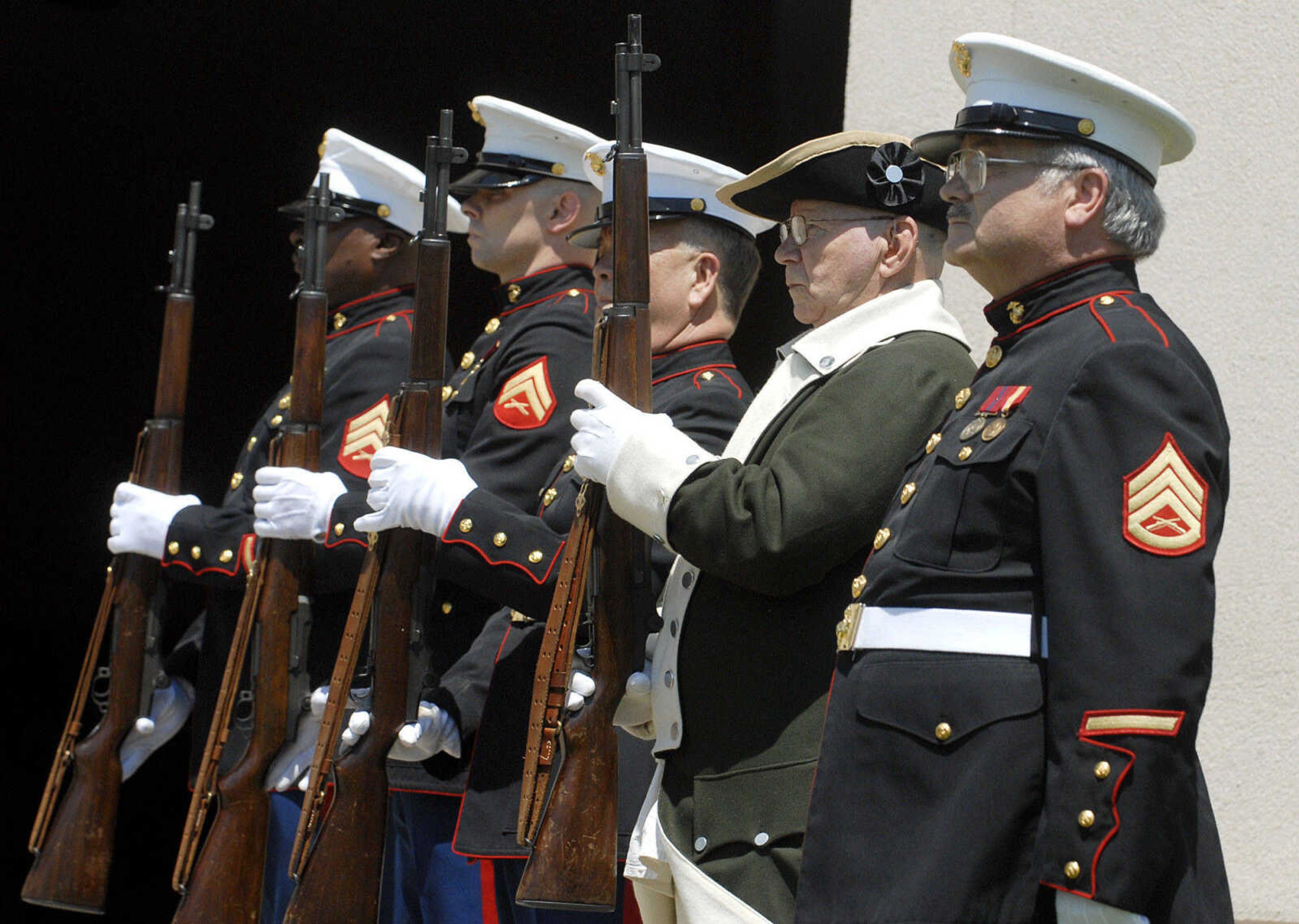 LAURA SIMON~lsimon@semissourian.com
Members of Marine Corp League 1081 from left,  Sgt. Paul Bedell, Cpl. Matt Anders, Cpl. Bob Francis, Cpl. Arlie Chronister and staff Sgt. Jim Halstead ready for the gun salute during the Memorial Day service Monday, May 30, 2011 at the Osage Centre in Cape Girardeau.