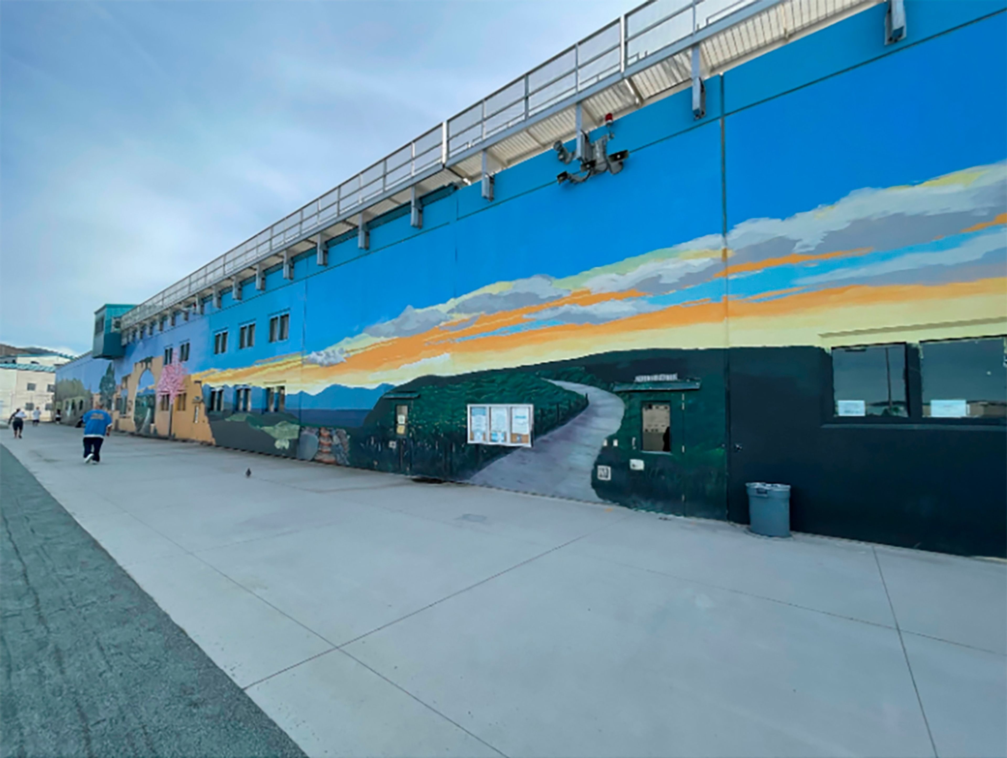 This undated image provided by California Department of Corrections and Rehabilitation shows a mural inside the prison yard at the Richard J. Donovan Correctional Facility in San Diego, where Lyle and Erik Menendez launched a beautification program in 2018. (California Department of Corrections and Rehabilitation via AP)