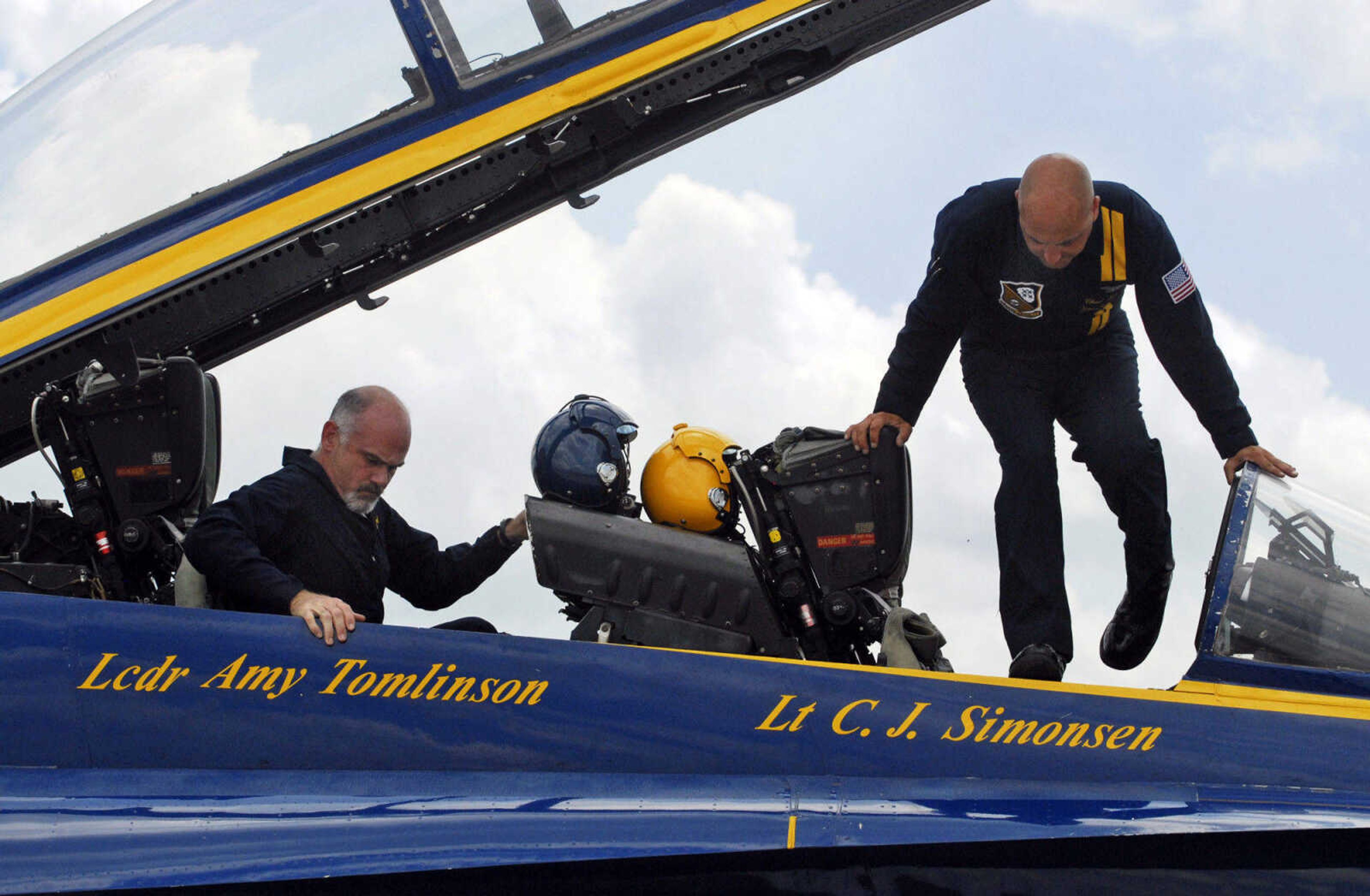 KRISTIN EBERTS ~ keberts@semissourian.com

Neil Berry, left, gets situated in the Blue Angels' F/A-18 plane with the help of #7 Crew Chief Chad Swanson, right, at the Cape Girardeau Airport on Wednesday, June 16, 2010. Berry was one of three area people who got the chance to fly with the Blue Angels on Wednesday.