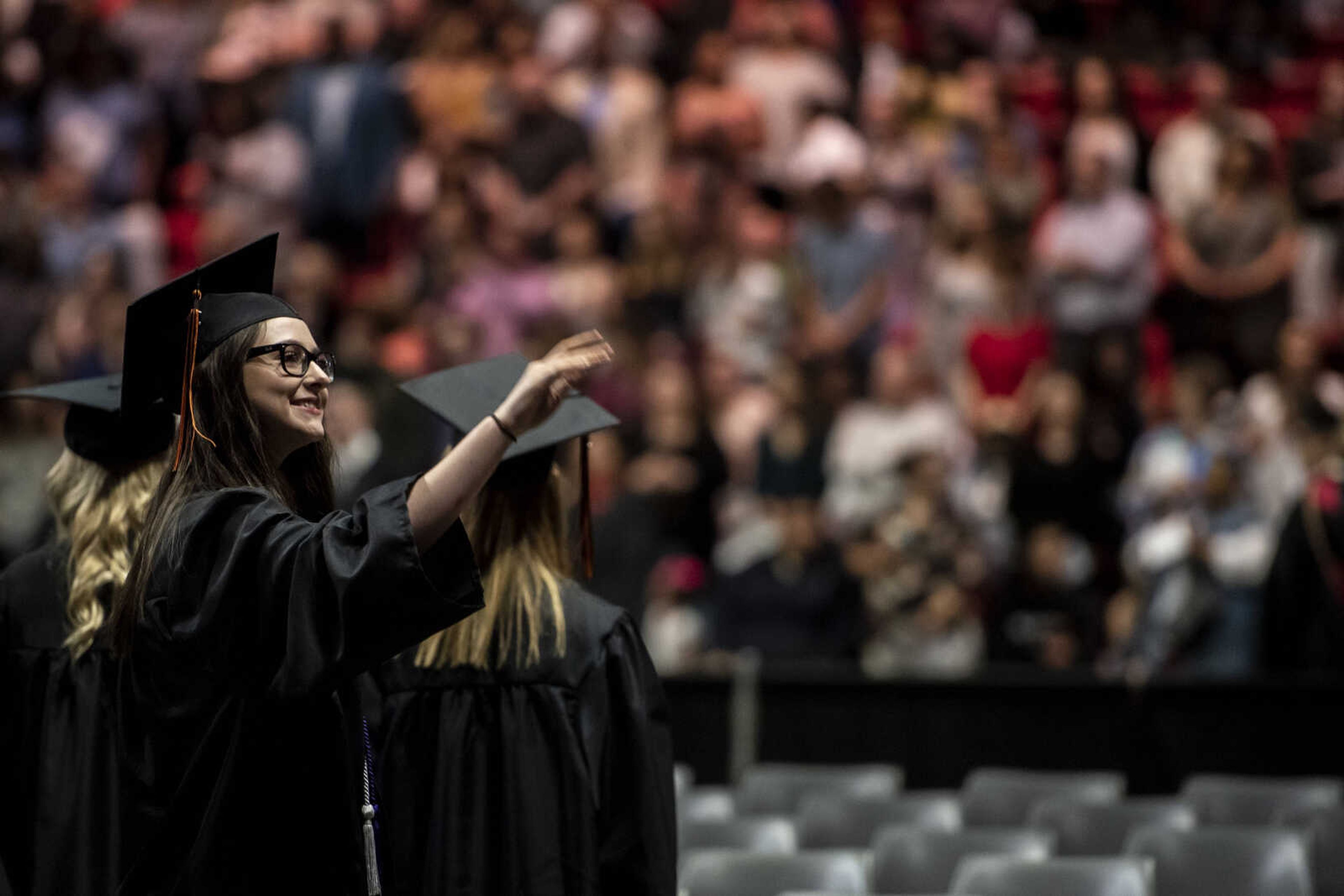 Emily Medlock waves to her family during the Cape Central High School Class of 2019 Commencement at the Show Me Center Sunday, May 12, 2019, in Cape Girardeau.