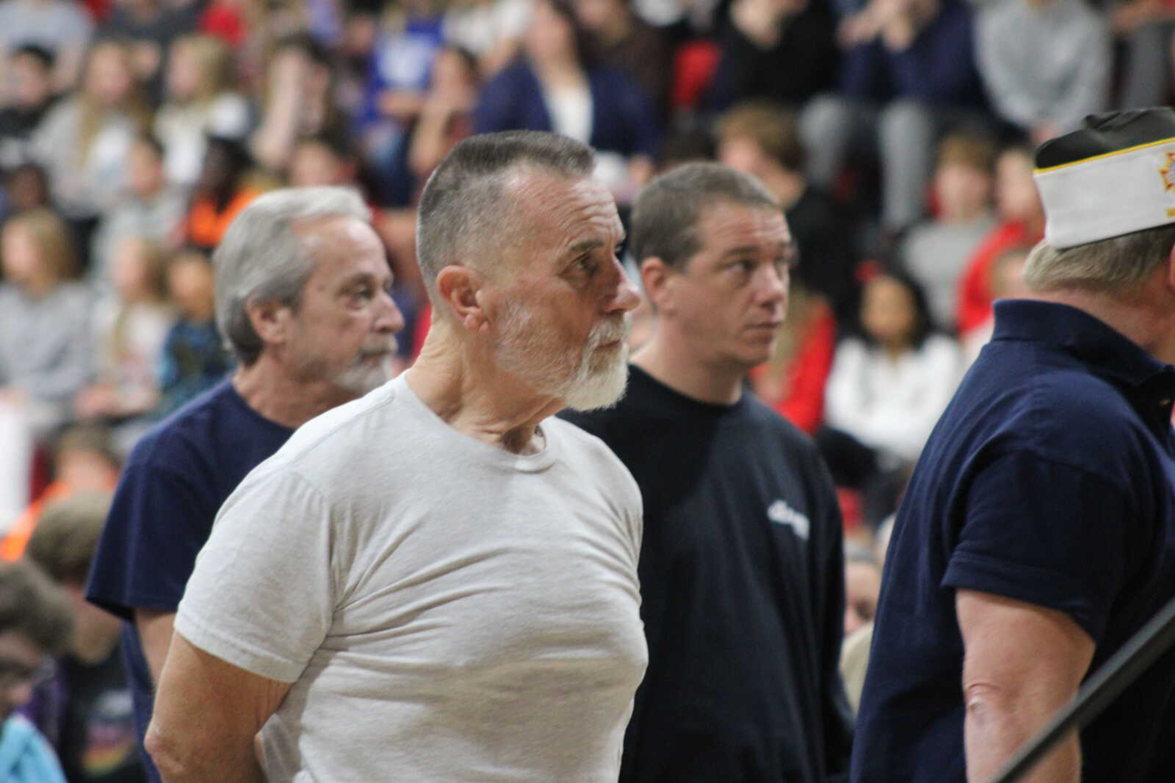 Veterans in attendee stand when their branch is called during the Armed Forces on Parade played by the Chaffee High school band.&nbsp;