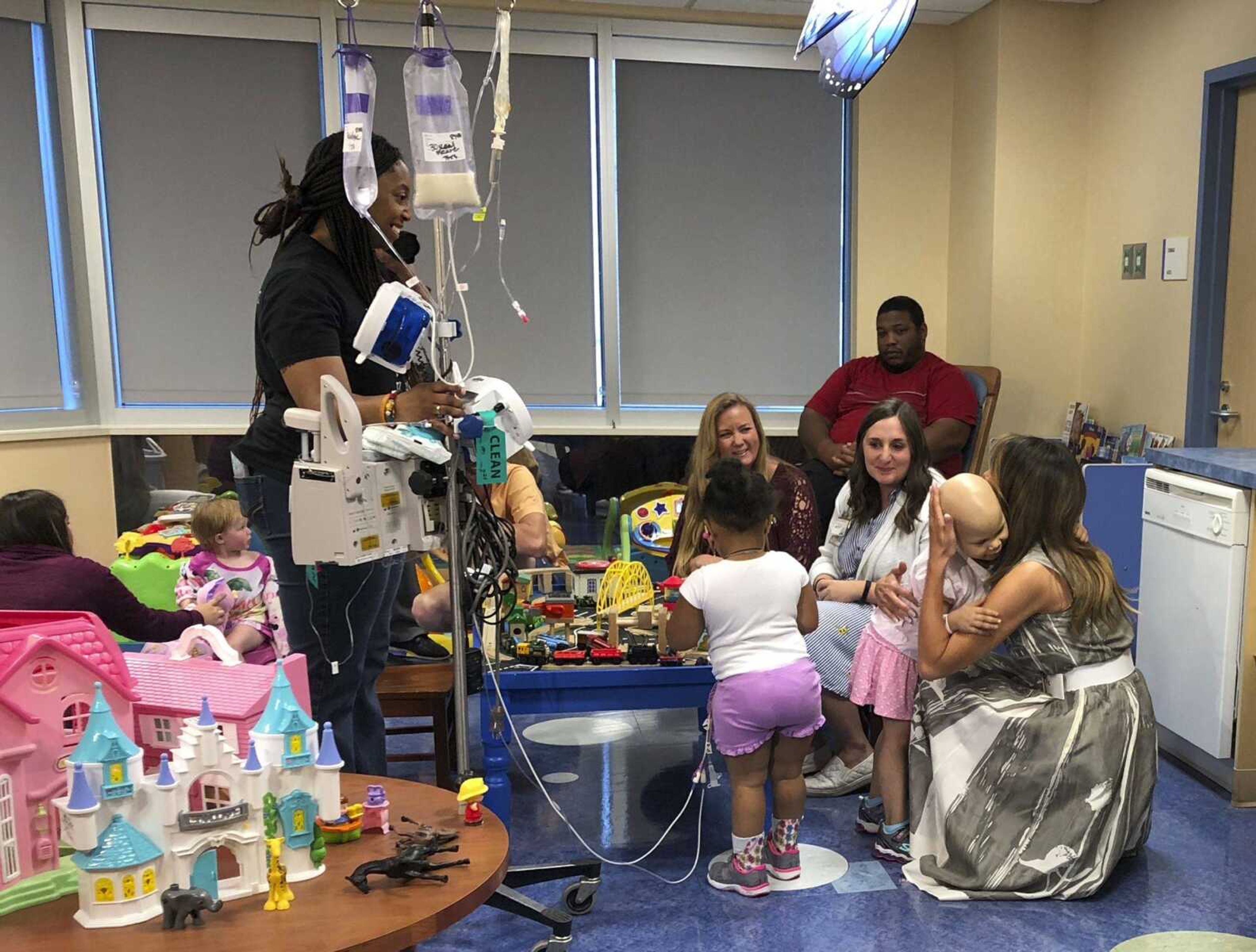 First lady Melania Trump, right, hugs a child in a playroom during a visit Tuesday to Monroe Carell Jr. Children's Hospital at Vanderbilt in Nashville, Tennessee. The first lady was promoting her "Be Best" campaign to help children.