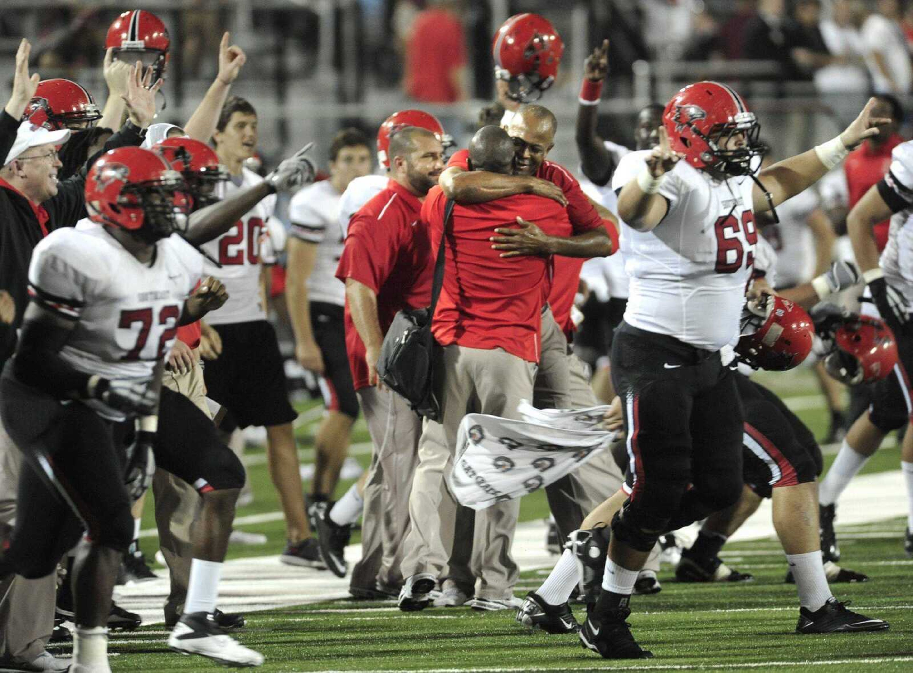 Southeast Missouri State coach Tony Samuel celebrates with his Redhawks team after their 24-21 victory over Southern Illinois on Saturday in Carbondale, Ill. (Fred Lynch)