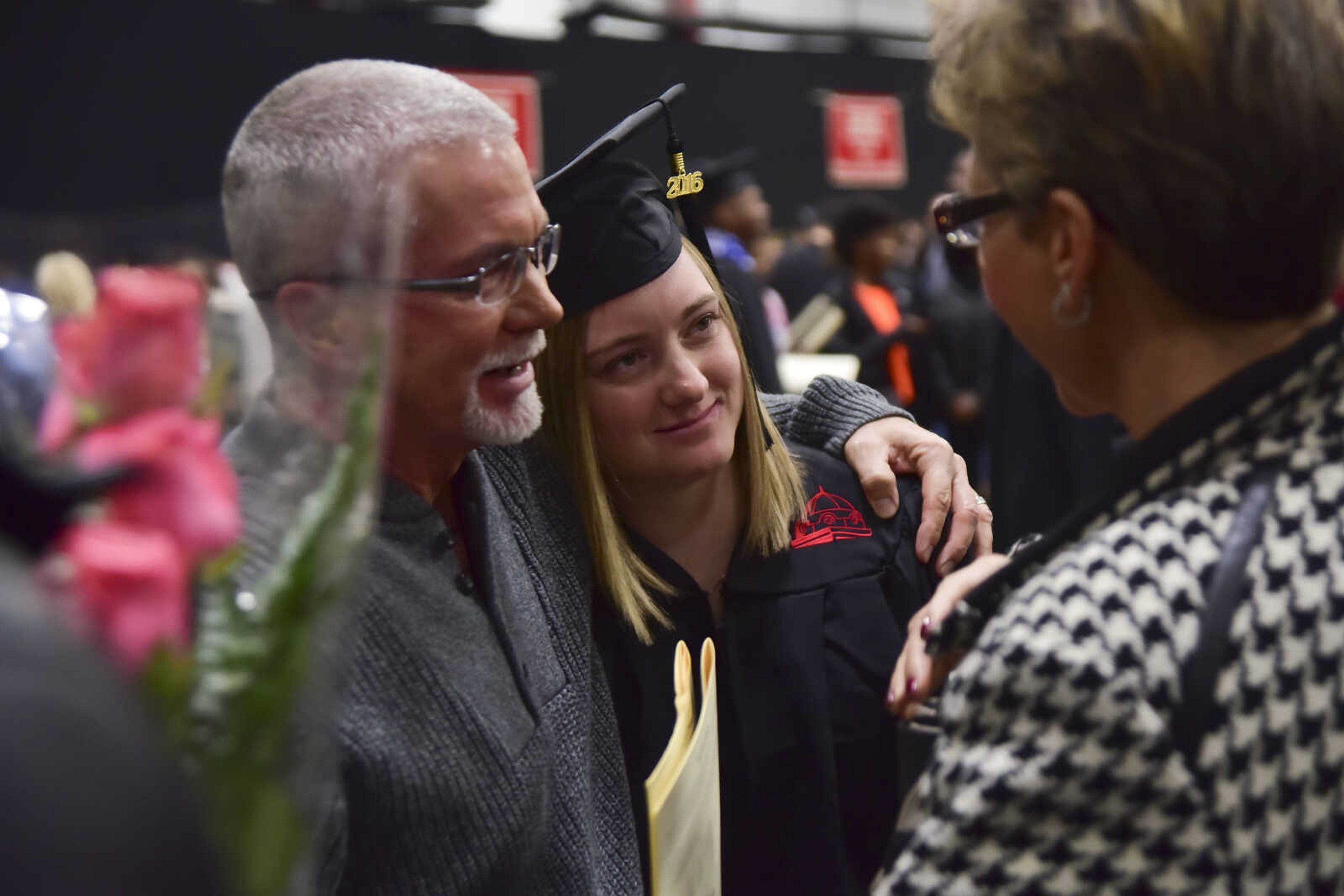 ANDREW J. WHITAKER ~ awhitaker@semissourian.com
Dennie Meyerotto hugs his daughter Allison Meyerotto with his wife Denise Meyerotto after Southeast Missouri State University graduation Saturday, Dec. 17, 2016 at the Show Me Center in Cape Girardeau.