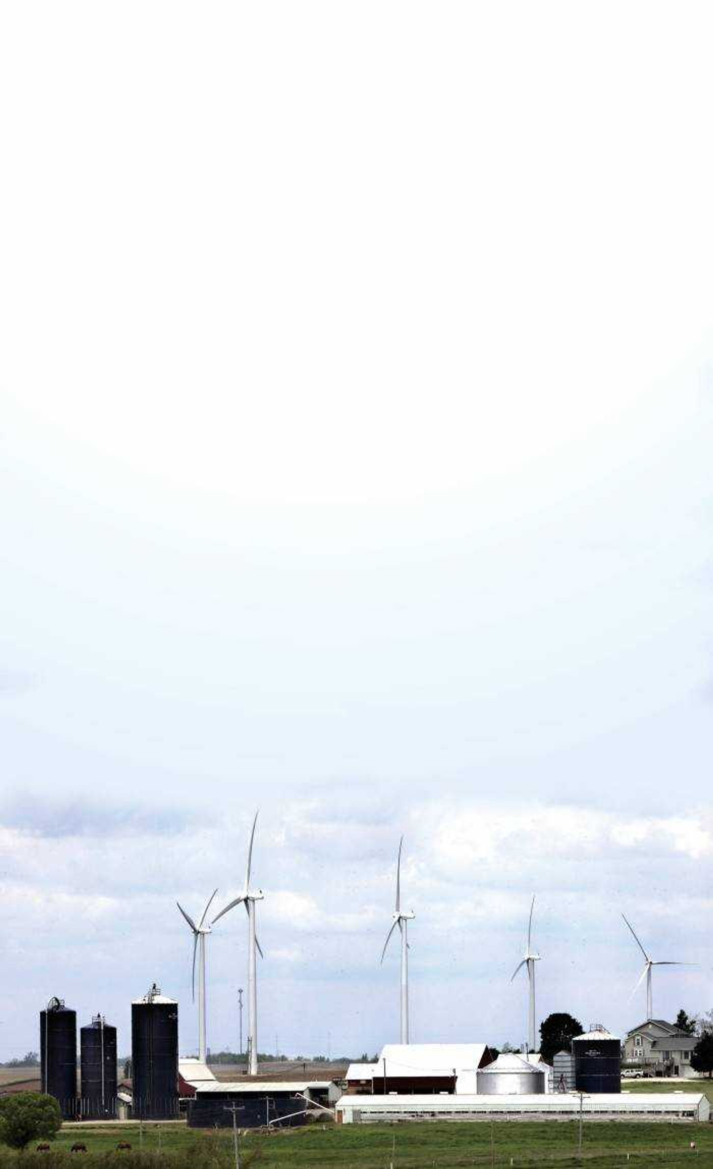 Five 400-foot-high wind turbines spun in a breeze at the Crescent Ridge Windpower Project near Tiskilwa, Ill. The 34 wind towers at the project can provide energy for about 1,500 households. (Associated Press)