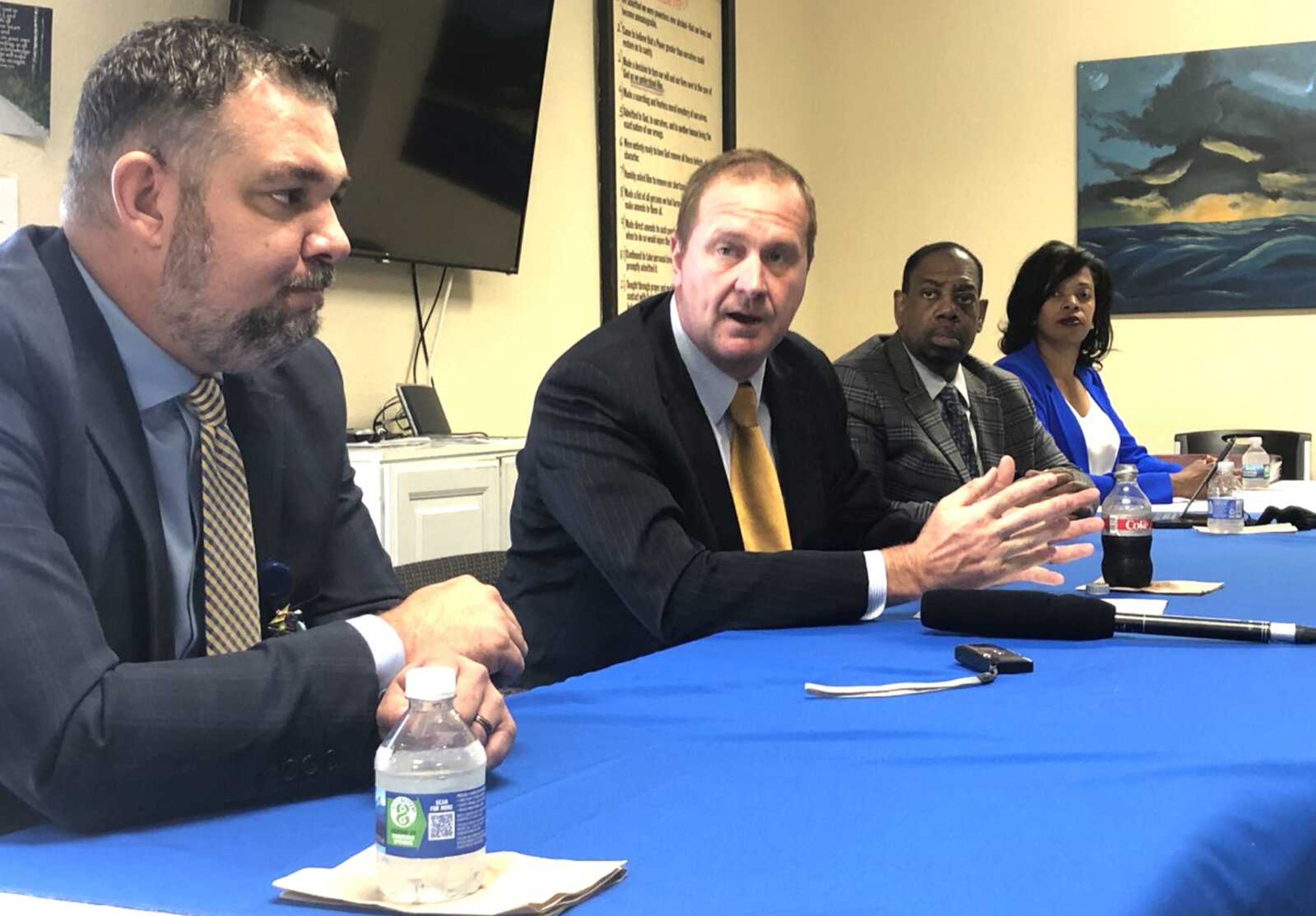 Missouri Attorney General Eric Schmitt, second from left, discusses terms of a $26 billion opioid litigation settlement Monday, which Missouri will share will several other states. With him are, from left, Gibson Recovery Center COO Ryan Essex, Gibson CEO John Gary and Tameka Randle, head of the Gibson Center Board of Directors.