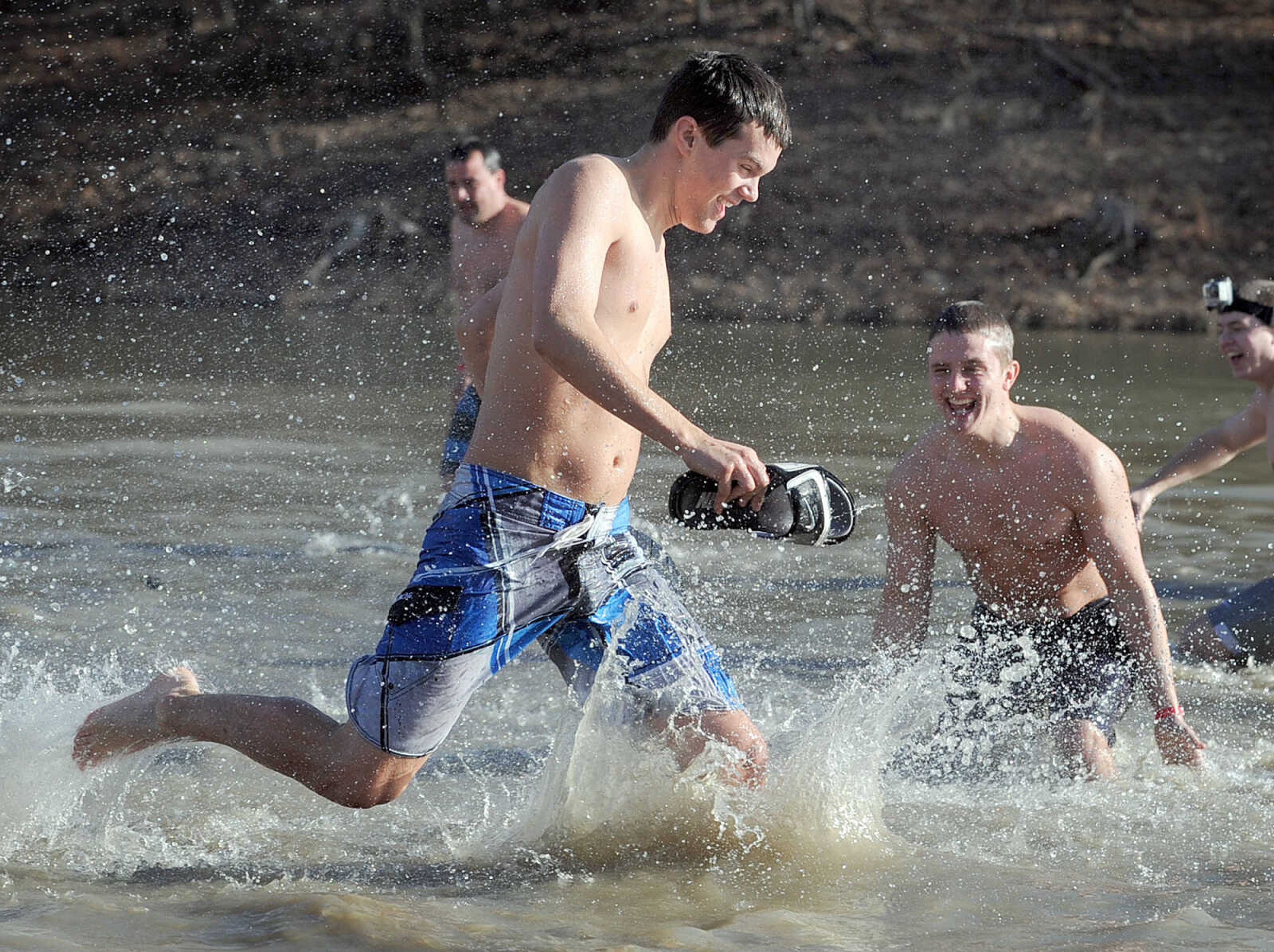 LAURA SIMON ~ lsimon@semissourian.com
People plunge into the cold waters of Lake Boutin Saturday afternoon, Feb. 2, 2013 during the Polar Plunge at Trail of Tears State Park. Thirty-six teams totaling 291 people took the annual plunge that benefits Special Olympics Missouri.