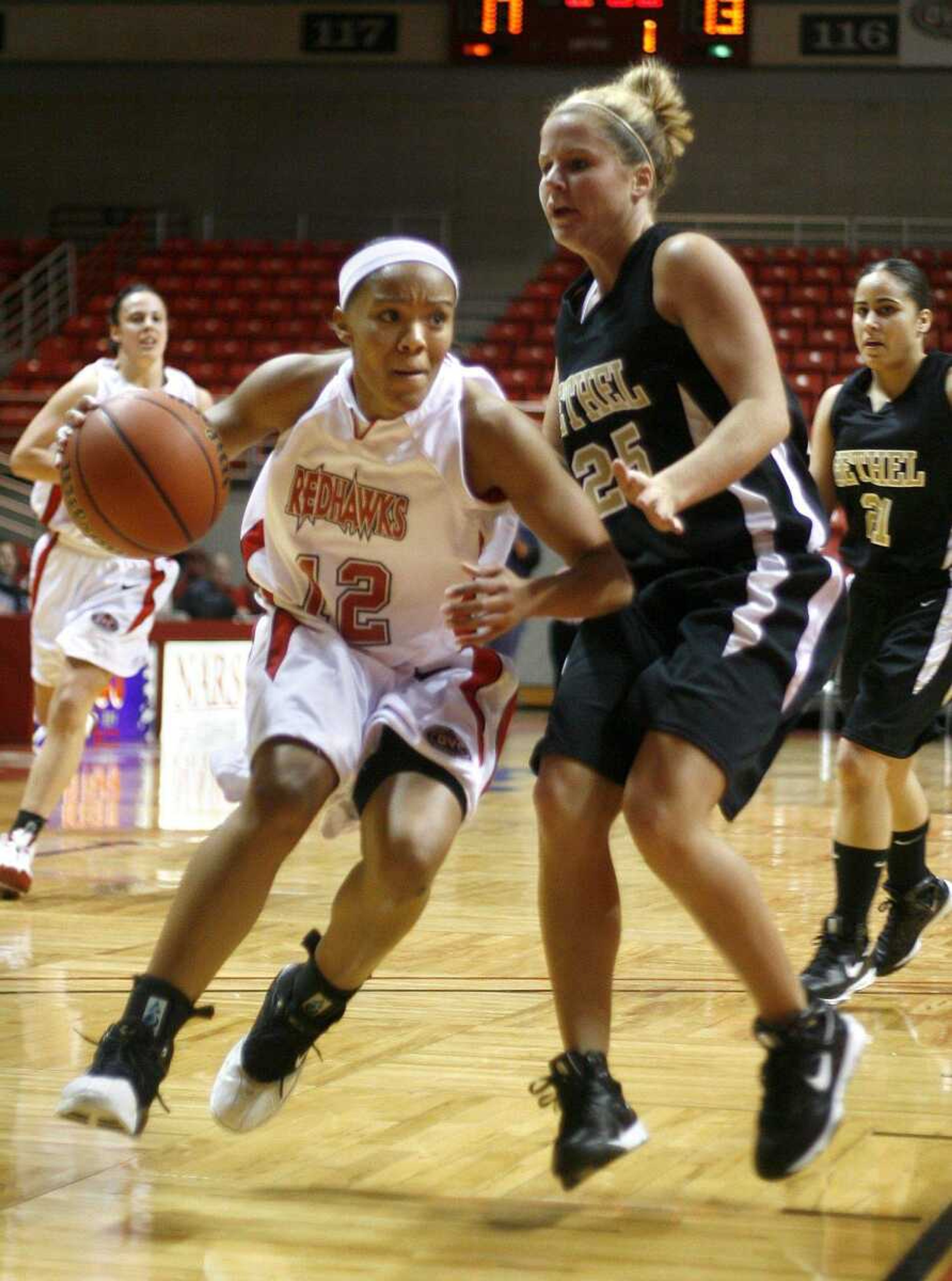 ELIZABETH DODD ~ edodd@semissourian.com
Southeast Missouri State's Tarina Nixon, left, drives to the basket against Bethel's Anna Trull.