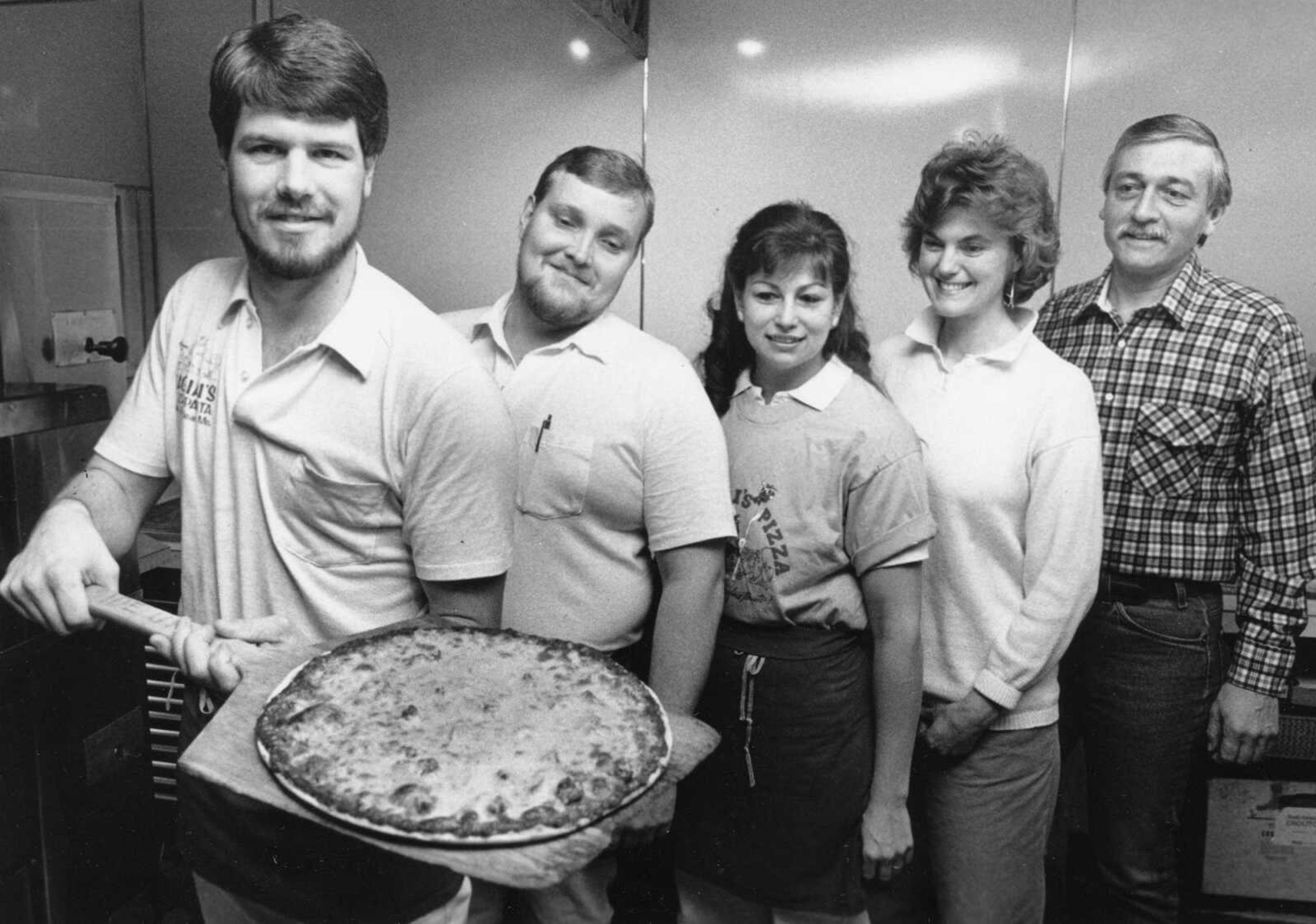 Published Jan. 22, 1989.
Pagliai's Pizza of Cape Girardeau observed its 20th anniversary in 1989. Shown here, from left, were co-managers, Paul Shaw, Bruce Holland and Barbara Logue, and owners, Judy and Mark Watson. (Southeast Missourian archive)