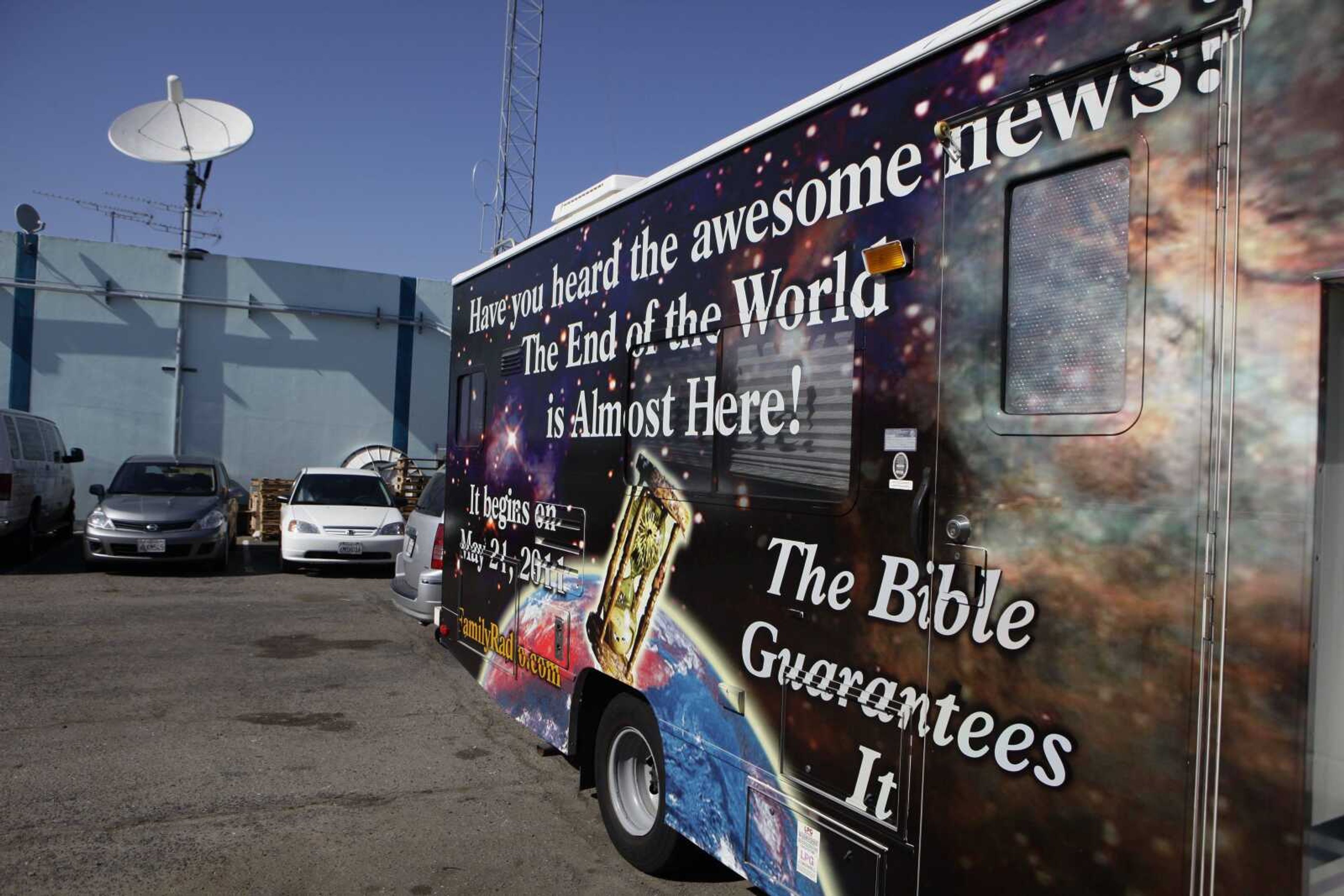 Signs on an RV Monday announce the end of the world outside of Harold Camping's ministry in Oakland, Calif. Camping, a radio and television preacher, had predicted the end of the world this past Saturday. (Marcio Jose Sanchez ~ Associated Press)