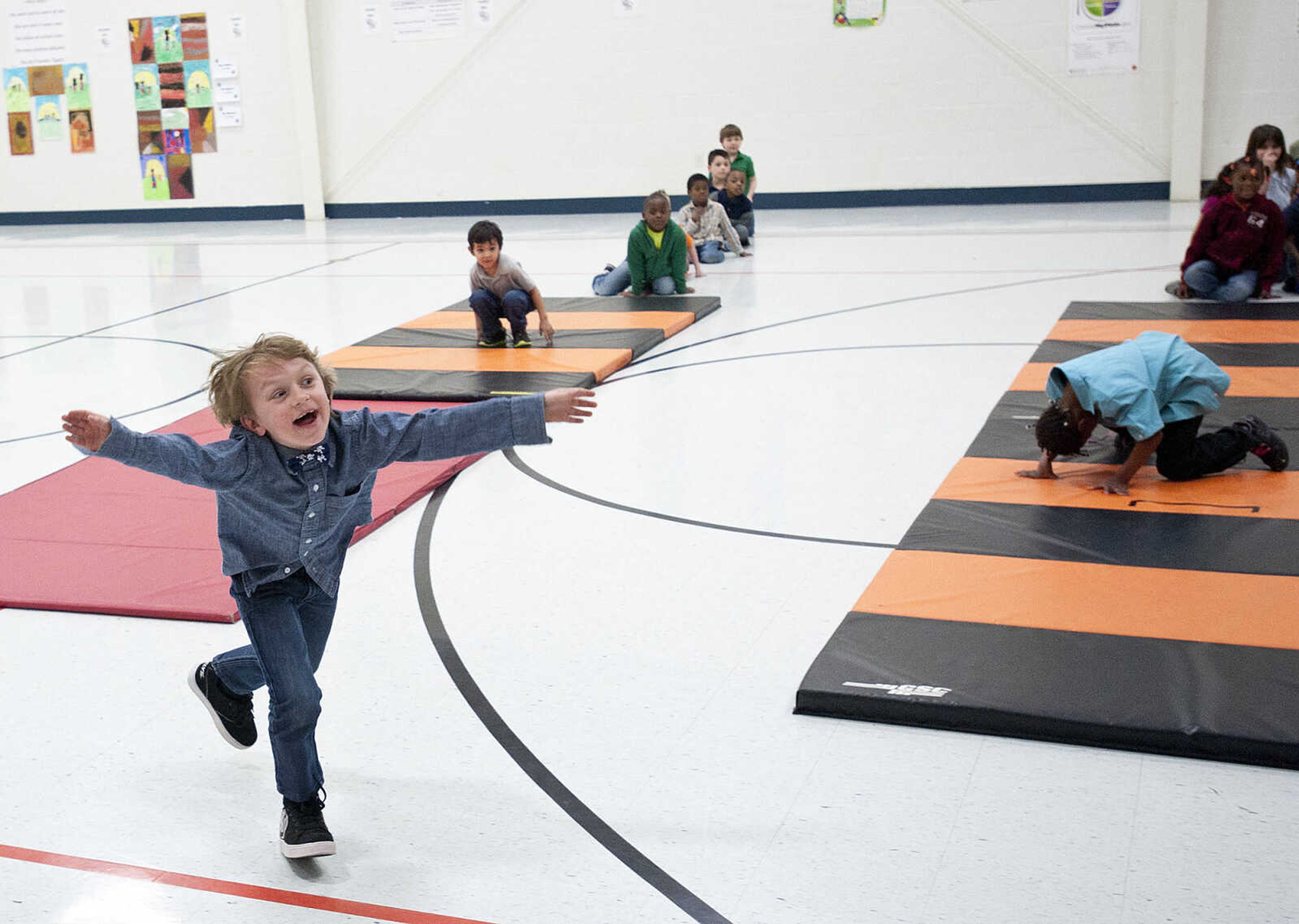 Gabriel Weimer, 6, reacts as his father, Command Chief Master Sgt. Geoff Weimer walks into the gym Friday, March 14, at Franklin Elementary School in Cape Girardeau. Sgt. Weimer is on leave from the Air Force after being deployed in the Middle East since Oct., and surprised his three sons, Geordan, 11, Eli, 9, and Gabriel, 6, in their respective classes.