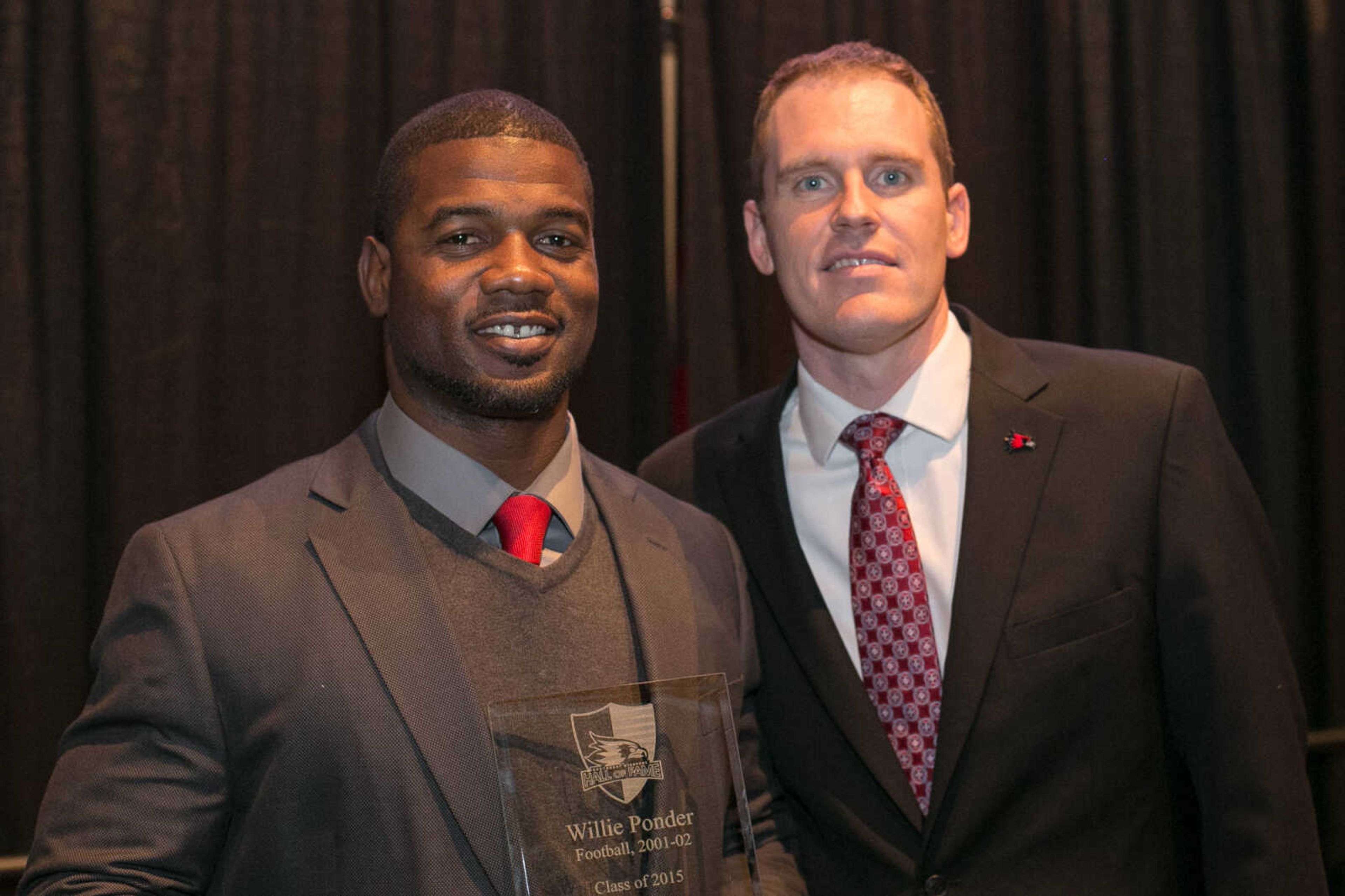 Willie Ponder (Football 2001-2002) poses for a photo with Interim Director of Athletics Brady Barke during his induction into the Southeast Missouri State University Athletic Hall of Fame Friday, Feb. 19, 2016 at the Show Me Center.