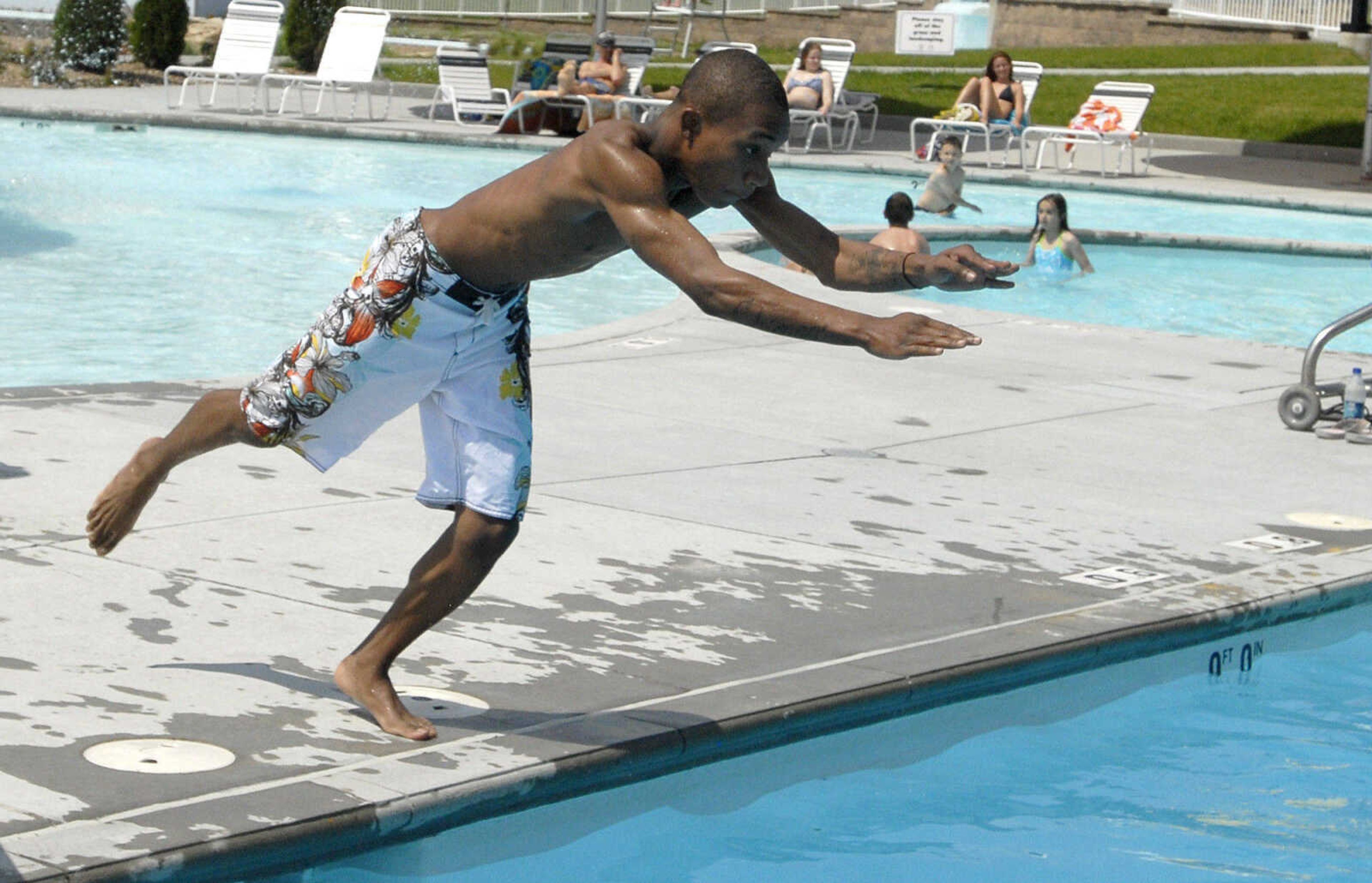 LAURA SIMON~lsimon@semissourian.com
Malik Johnson dives into the leisure pool Saturday, May 28, 2011 during opening day of Cape Splash Family Aquatic Center in Cape Girardeau.