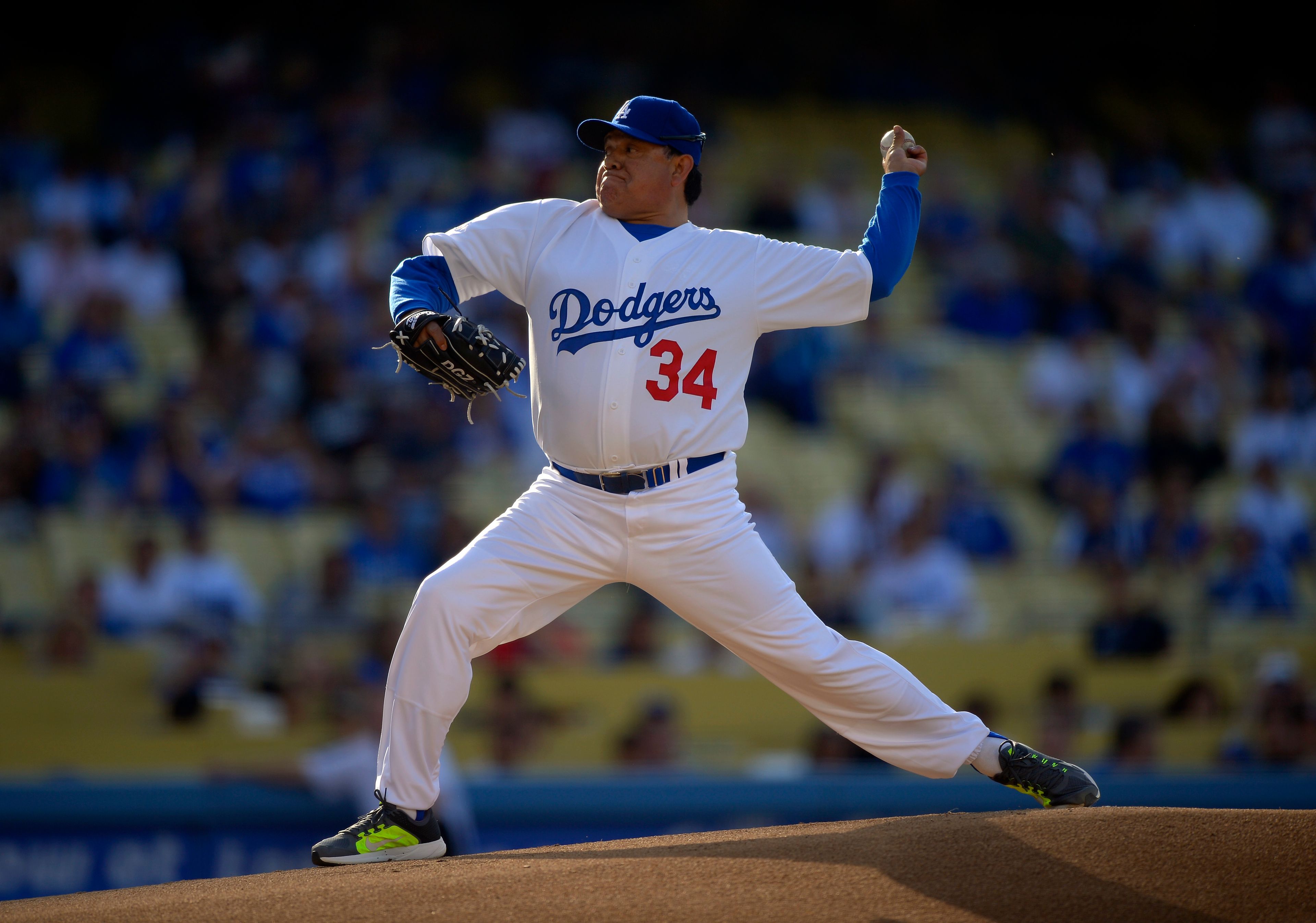 FILE - Fernando Valenzuela throws to the plate during the Old-Timers baseball game, June 8, 2013, in Los Angeles. Fernando Valenzuela, the Mexican-born phenom for the Los Angeles Dodgers who inspired “Fernandomania” while winning the NL Cy Young Award and Rookie of the Year in 1981, has died Tuesday, Oct. 22, 2024. (AP Photo/Mark J. Terrill, File)