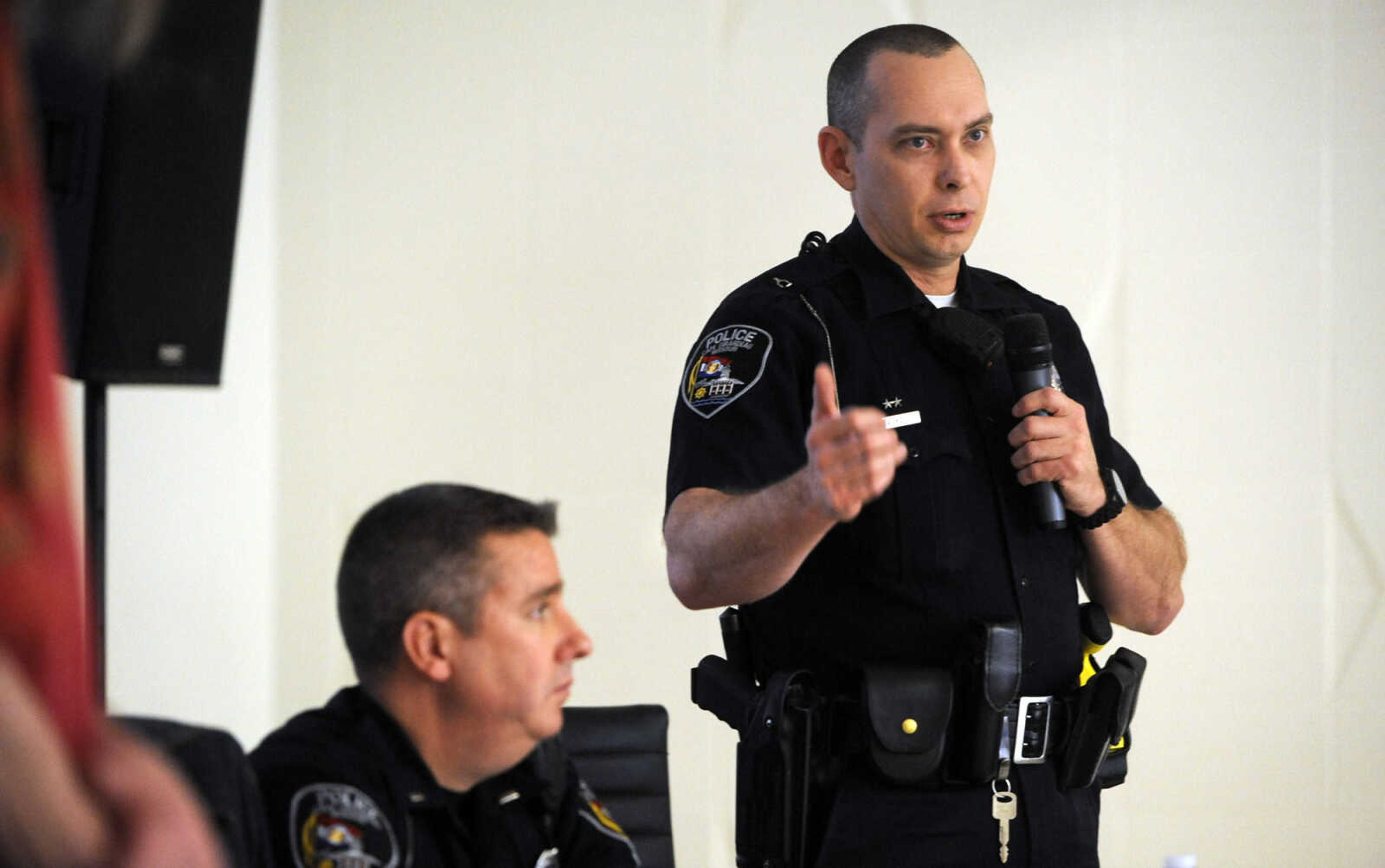 FRED LYNCH ~ flynch@semissourian.com
Patrolman Mike Kidd, community service officer with the Cape Girardeau Police Department, discusses a point as Lt. Brad Smith listens during the Know Your Rights event Saturday, Feb. 20, 2016 at The Concourse.