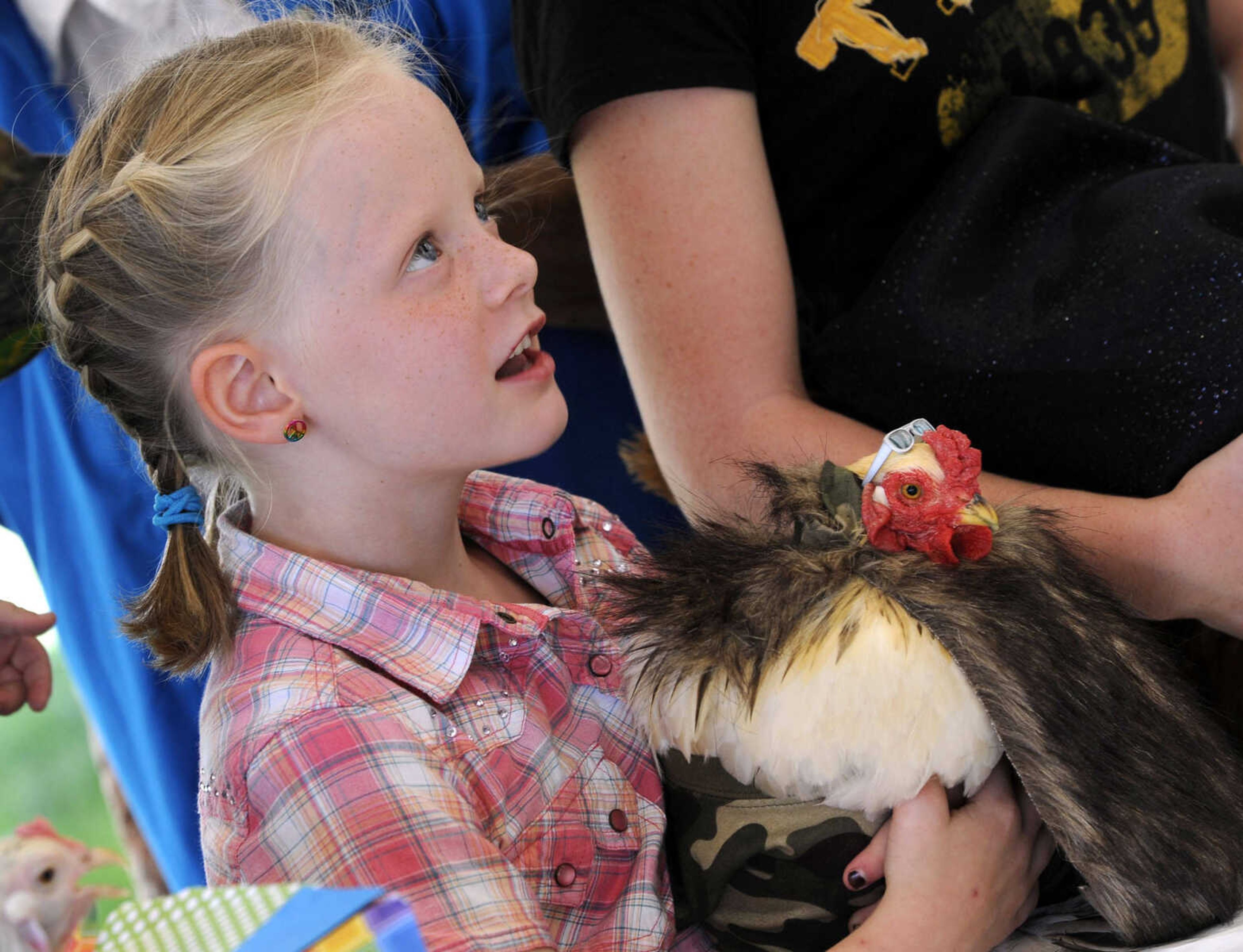 Jaylie Walther entered the poultry dress-up contest with her chicken portraying Phil Robertson on Sunday, Sept. 7, 2014 at the SEMO District Fair.