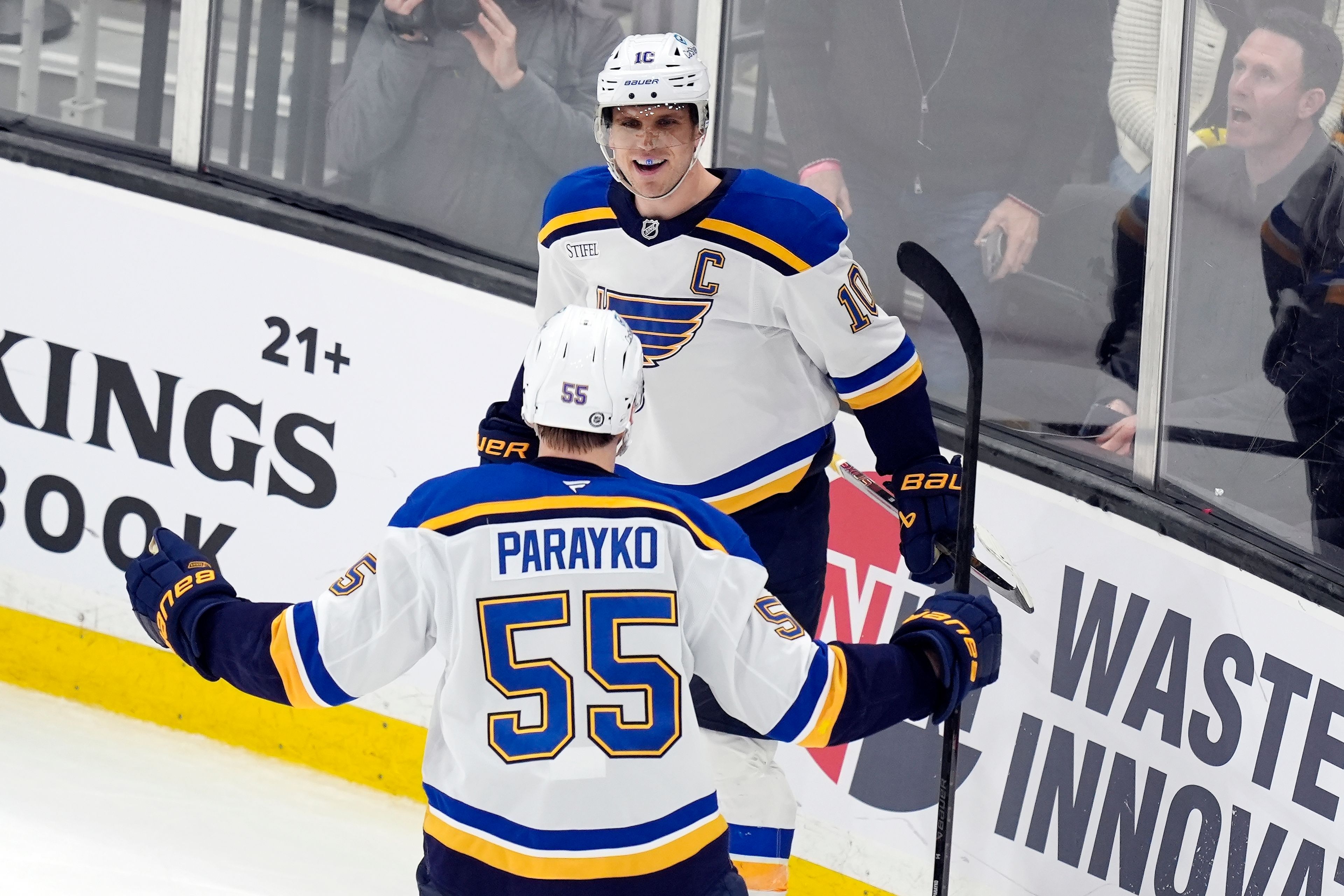 St. Louis Blues' Brayden Schenn (10) celebrates with Colton Parayko (55) after scoring in overtime during an NHL hockey game against the Boston Bruins, Saturday, Nov. 16, 2024, in Boston. (AP Photo/Michael Dwyer)