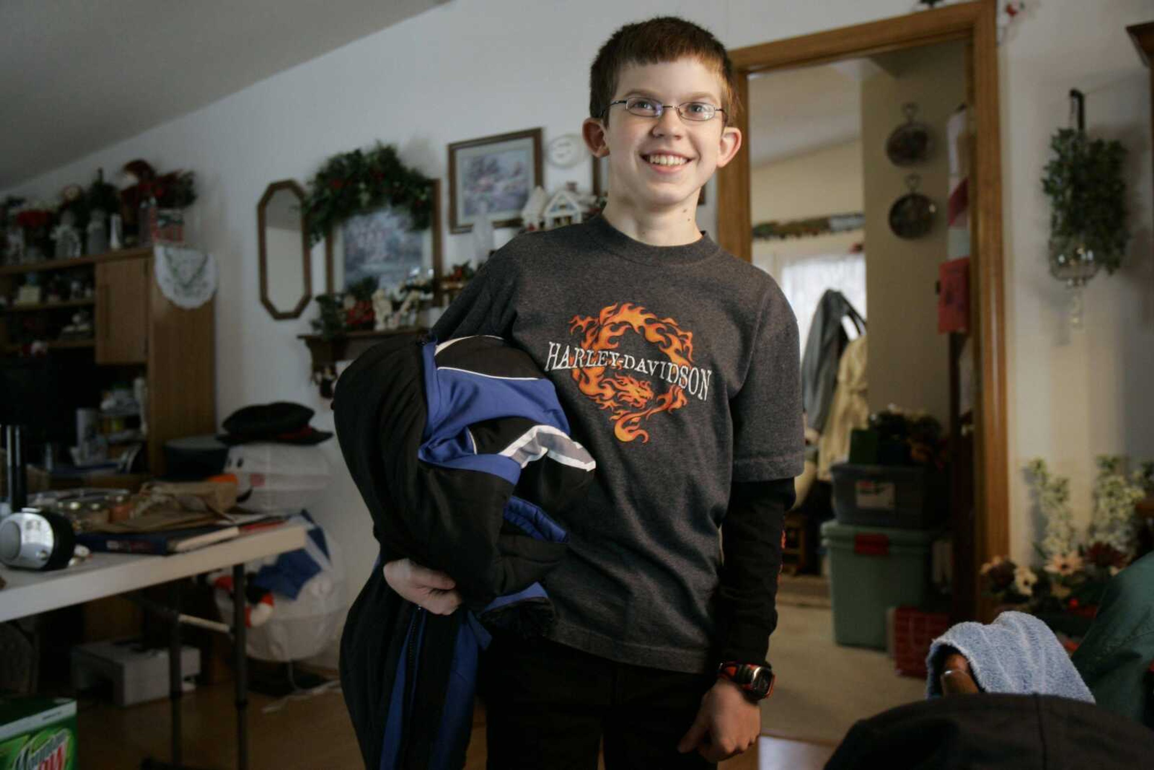 Ben Ownby, 13, stood in the living room of his home Jan. 16 in Beaufort, Mo., after he was reunited with his parents after being kidnapped. He was with Shawn Hornbeck, a 15-year-old boy who had disappeared more than four years earlier. The discovery was soon dubbed the "Missouri Miracle" and became a story that gained international attention in 2007. (Associated Press file)