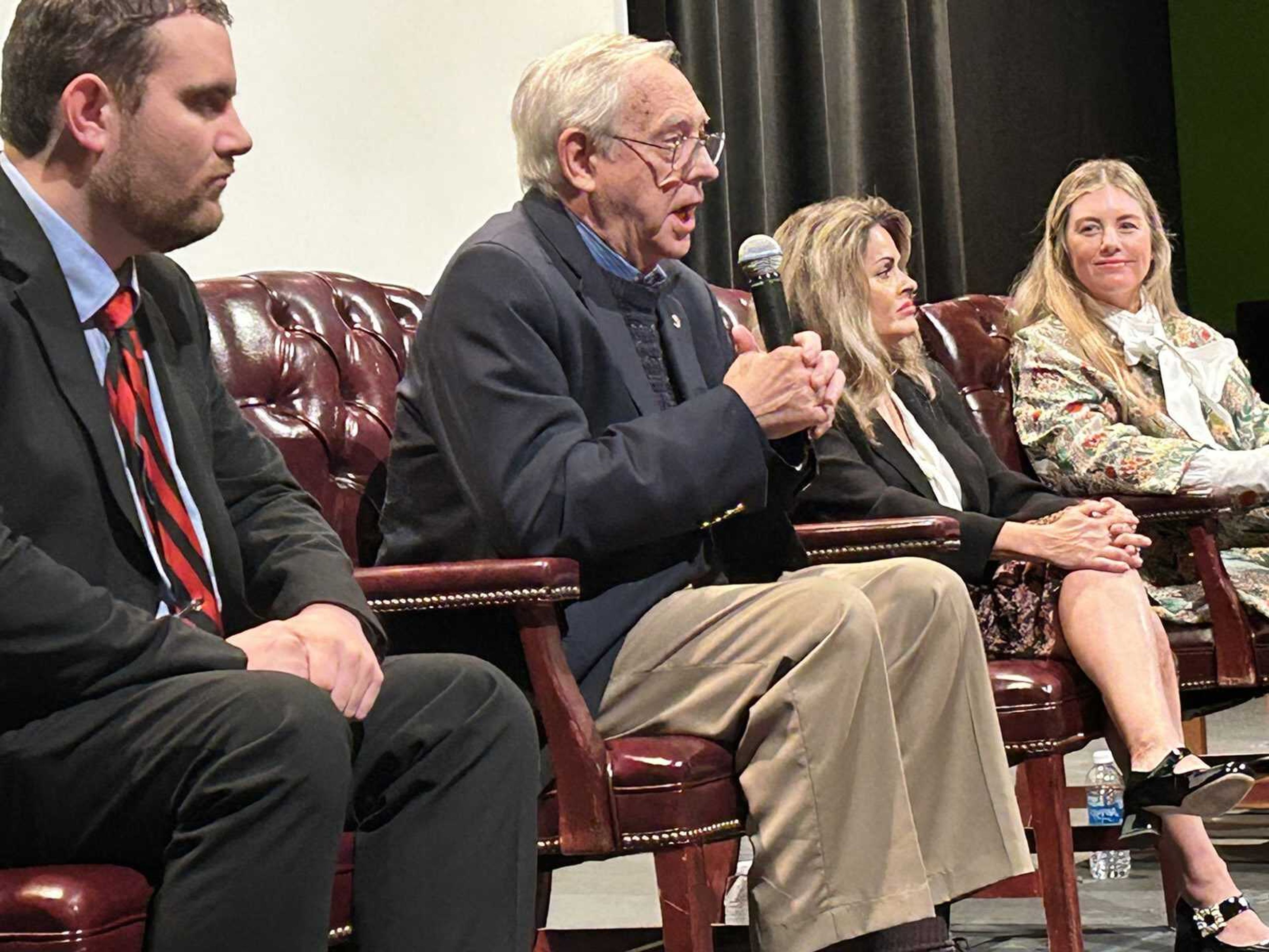 Retired Southeast Missouri State University professor Robert Hamblin speaks to the crowd Tuesday night, Nov. 14, as part of a panel following the screening of "Faulkner: The Past is Never Dead" at Rose Theatre in Cape Girardeau. Tyson Koenig, left, head of special collections and archives at the university;Anita Modak-Truran, executive producer; and Ana Lampton Triplett, producer, also participated in the forum.