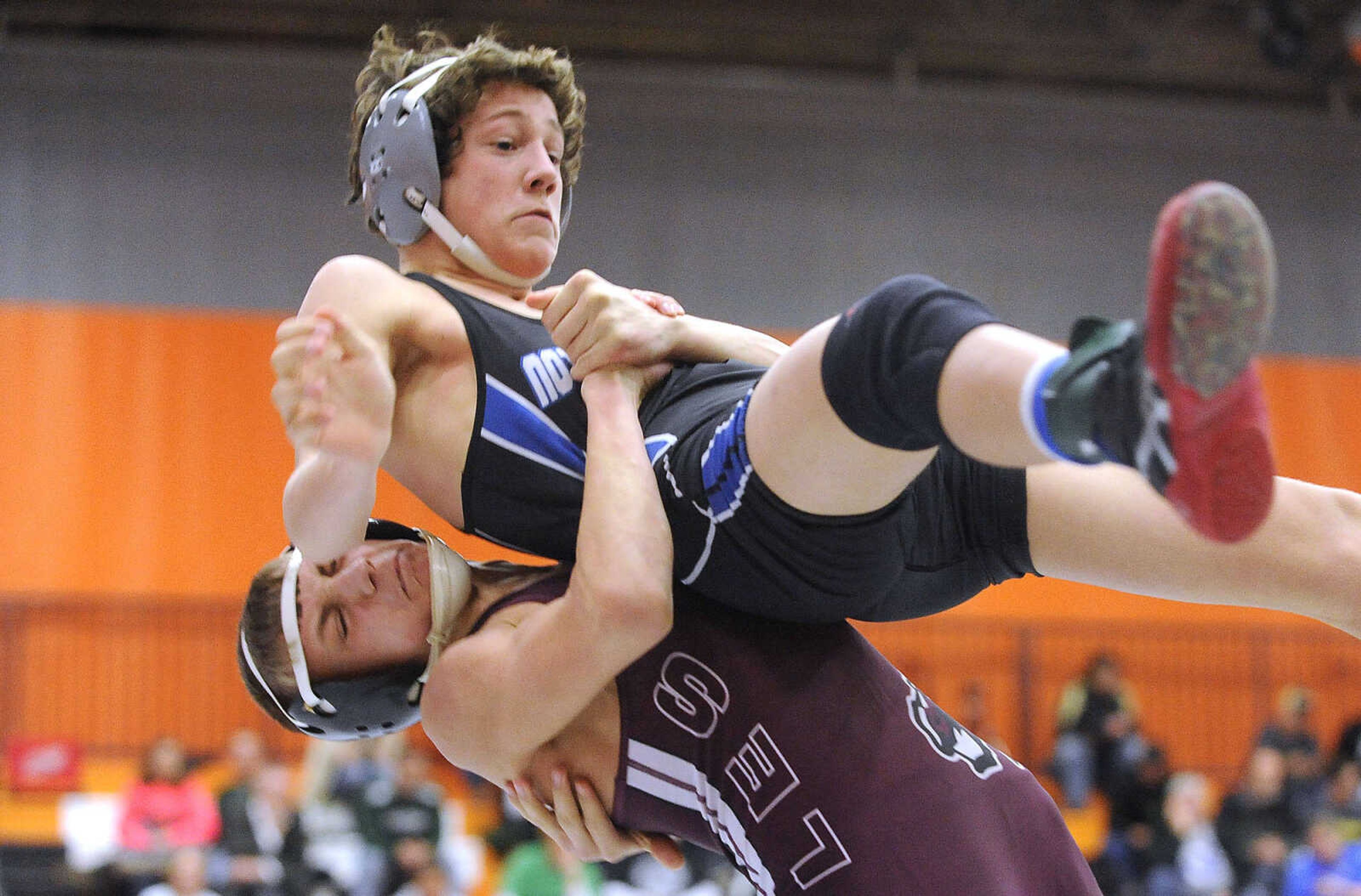 FRED LYNCH ~ flynch@semissourian.com
Notre Dame's Evan Dowdy gets lifted by Poplar Bluff's Kade Richardson in the 113-pound fifth-place match of the SEMO Conference Tournament on Saturday, Jan. 23, 2016 at Cape Central High School. Richardson won the match.