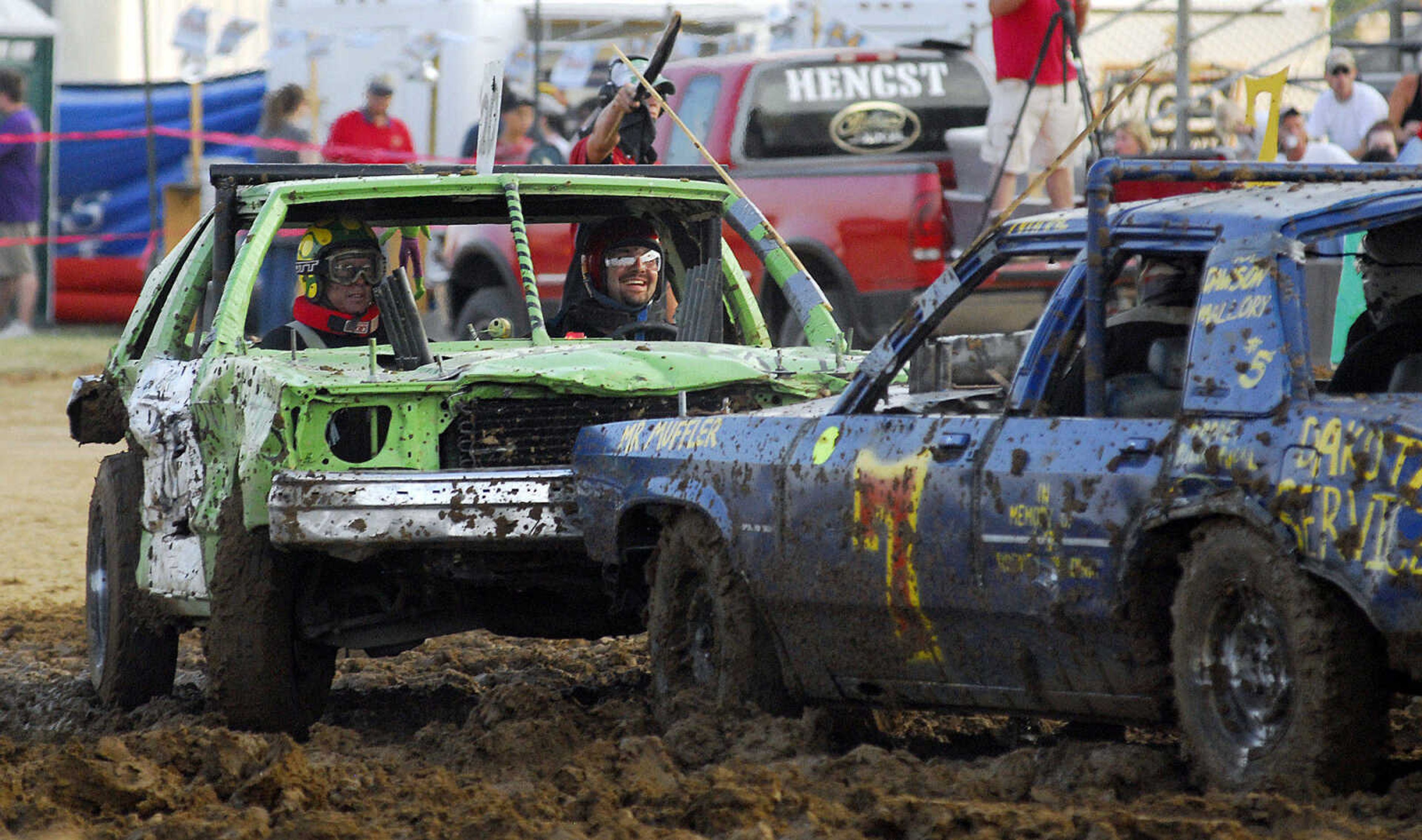 LAURA SIMON~lsimon@semissourian.com
Darrin Hobeck slams into another modified derby car during the dual demolition derby at the U.S.A. Veterans Fourth of July celebration at Arena Park in Cape Girardeau Sunday, July 4, 2010.