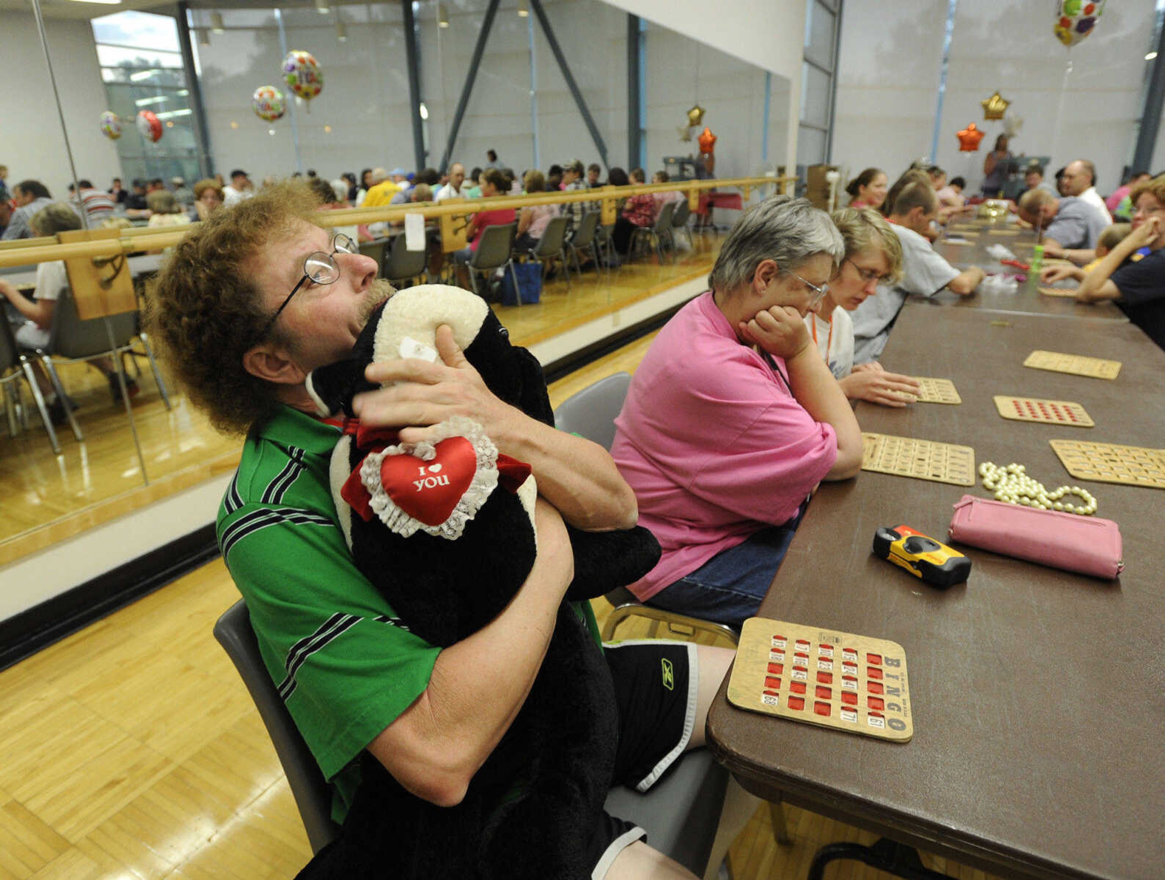 FRED LYNCH ~ flynch@semissourian.com
James Ross of Trenton, Mo. hugs his bingo prize that he won Saturday, Aug. 13, 2011 after a day of competition in the Special Olympics Missouri 2011 State Outdoor Championships.