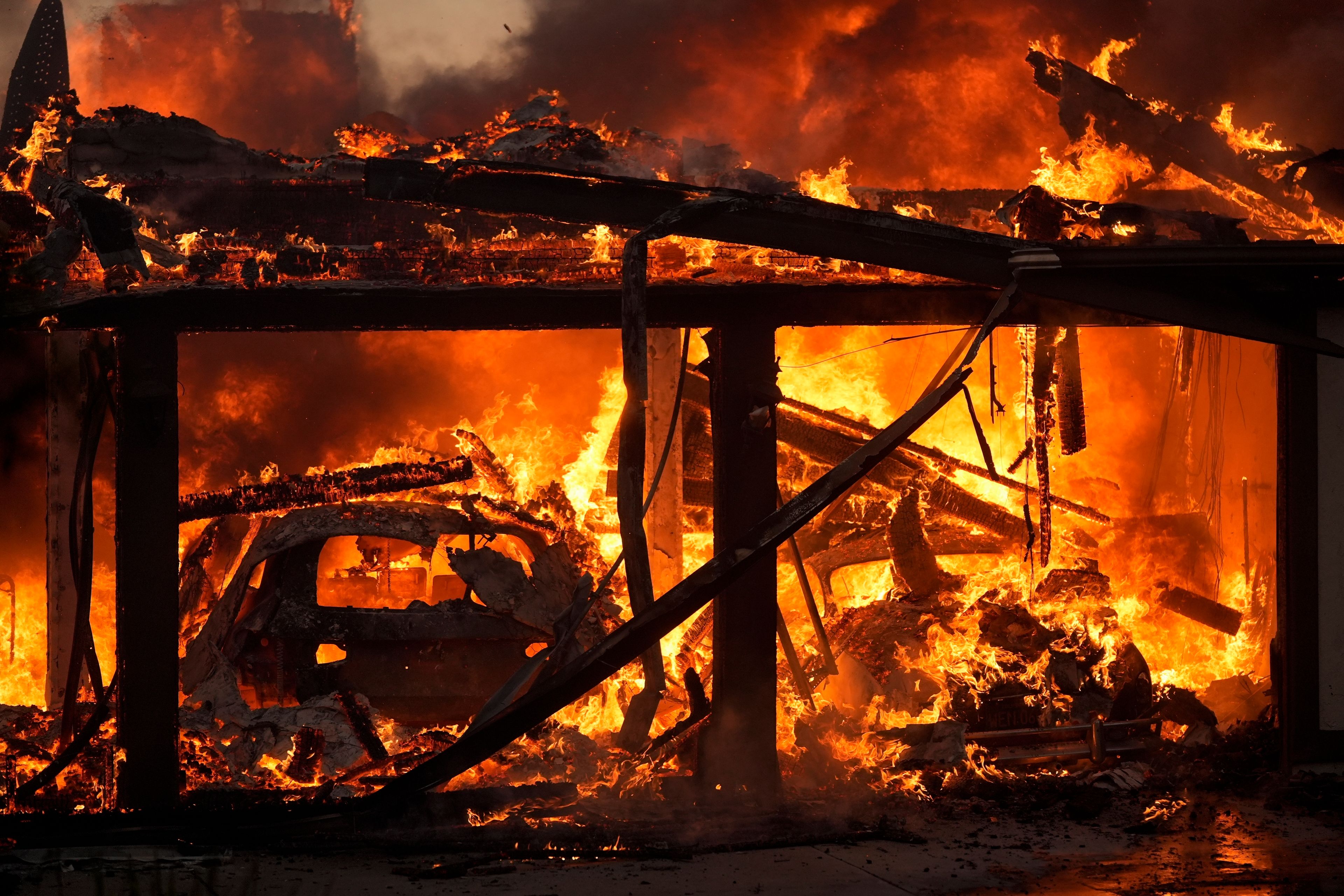 A home burns in the Mountain Fire, Nov. 6, 2024, in Camarillo, Calif. (AP Photo/Marcio Jose Sanchez)