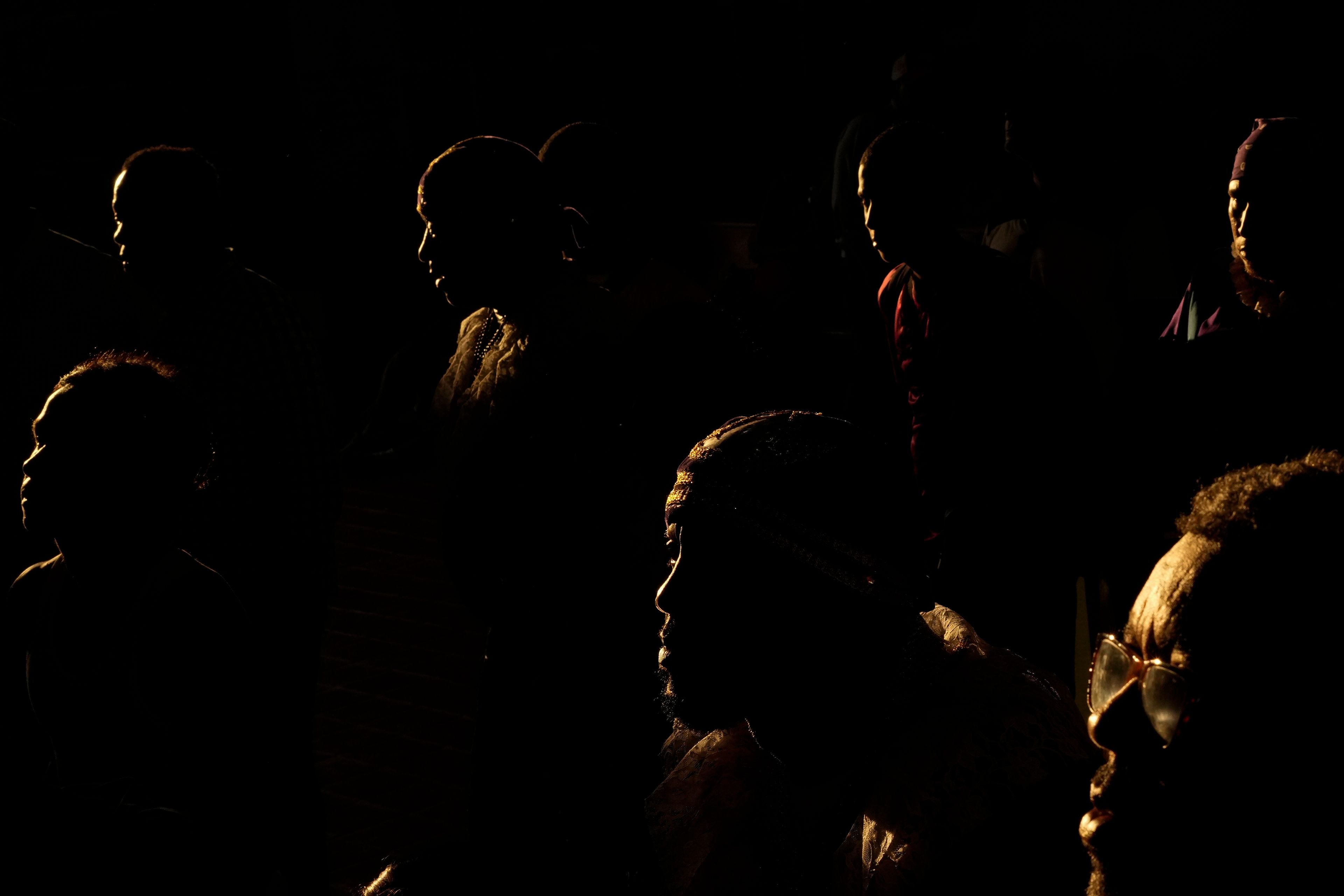 Pilgrims arrive inside San Felipe Church to honor the Black Christ in Portobelo, Panama, early Monday, Oct. 21, 2024, during a festival celebrating the iconic statue that was found on the shore in 1658. (AP Photo/Matias Delacroix)