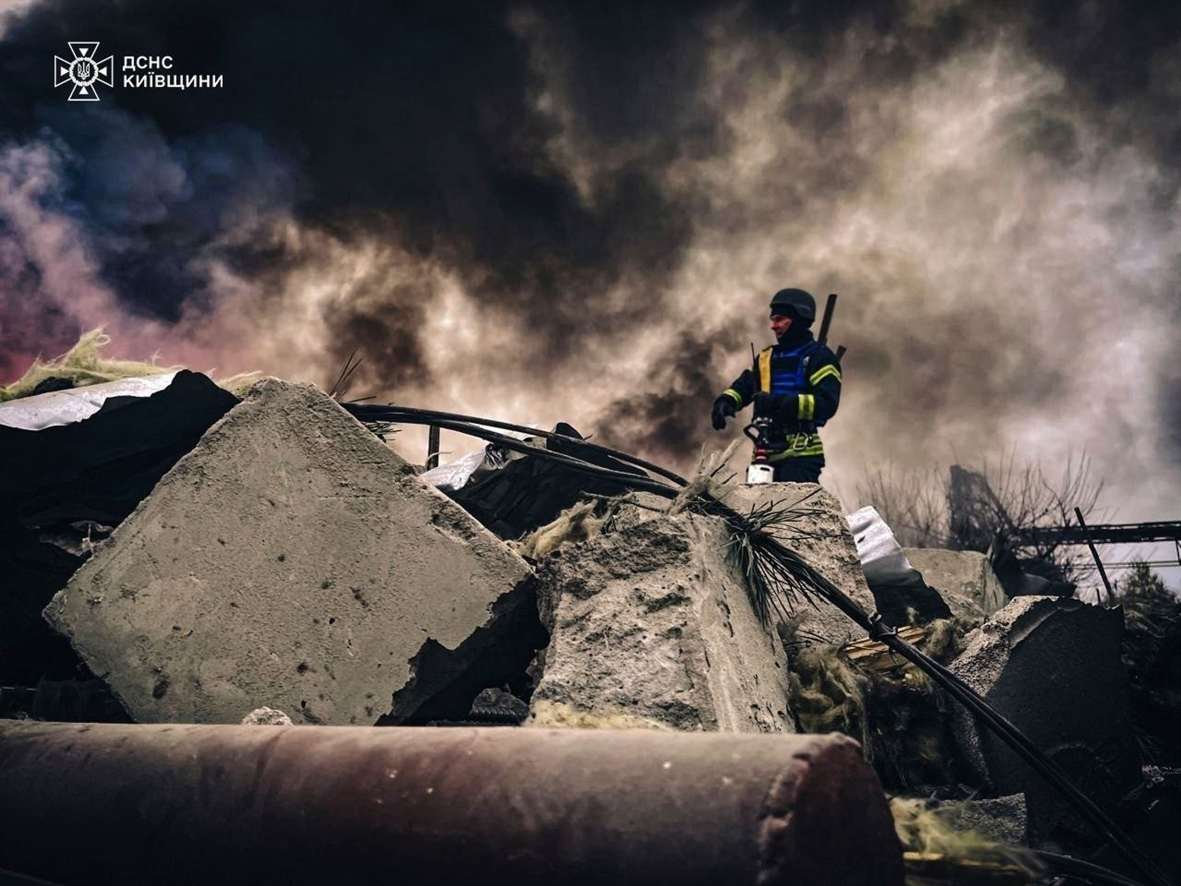 In this photo provided by the Ukrainian Emergency Service on Nov. 13, 2024, rescue workers clear the rubble of a building destroyed by a Russian strike in Brovary, outside Kyiv, Ukraine. (Ukrainian Emergency Service via AP)