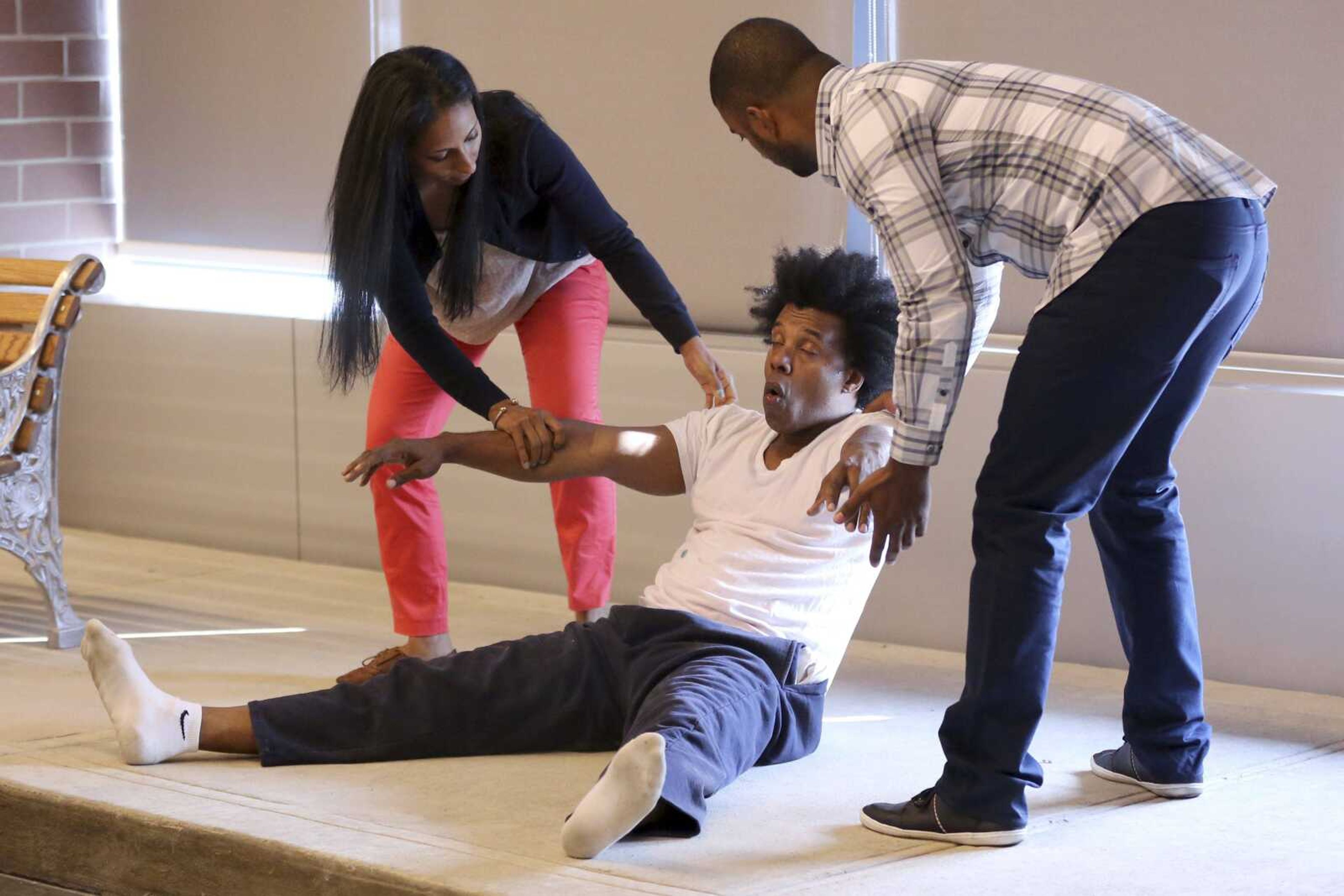 Officers Danny Lora, right, and Maryan Soliman assist actor Grant Cooper during a Crisis Intervention Training class Sept. 2 at the New York Police Department Police Academy. (Mary Altaffer ~ Associated Press)