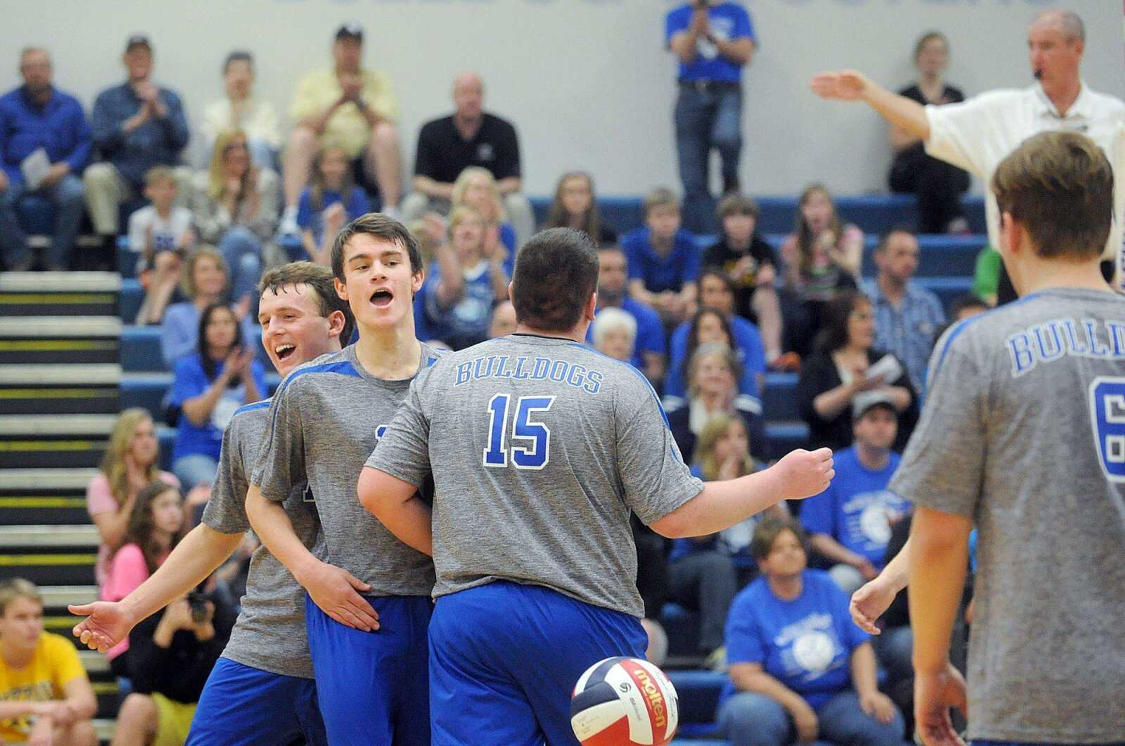 Notre Dame&#8217;s Collin Kramer, left, Tyler Allen, center, and Rhett Simmons celebrate a point during the third set of Thursday&#8217;s match against Duchesne at Notre Dame Regional High School. The first-year Notre Dame boys volleyball program hosted its first match. More photos can be viewed online. (Laura Simon)