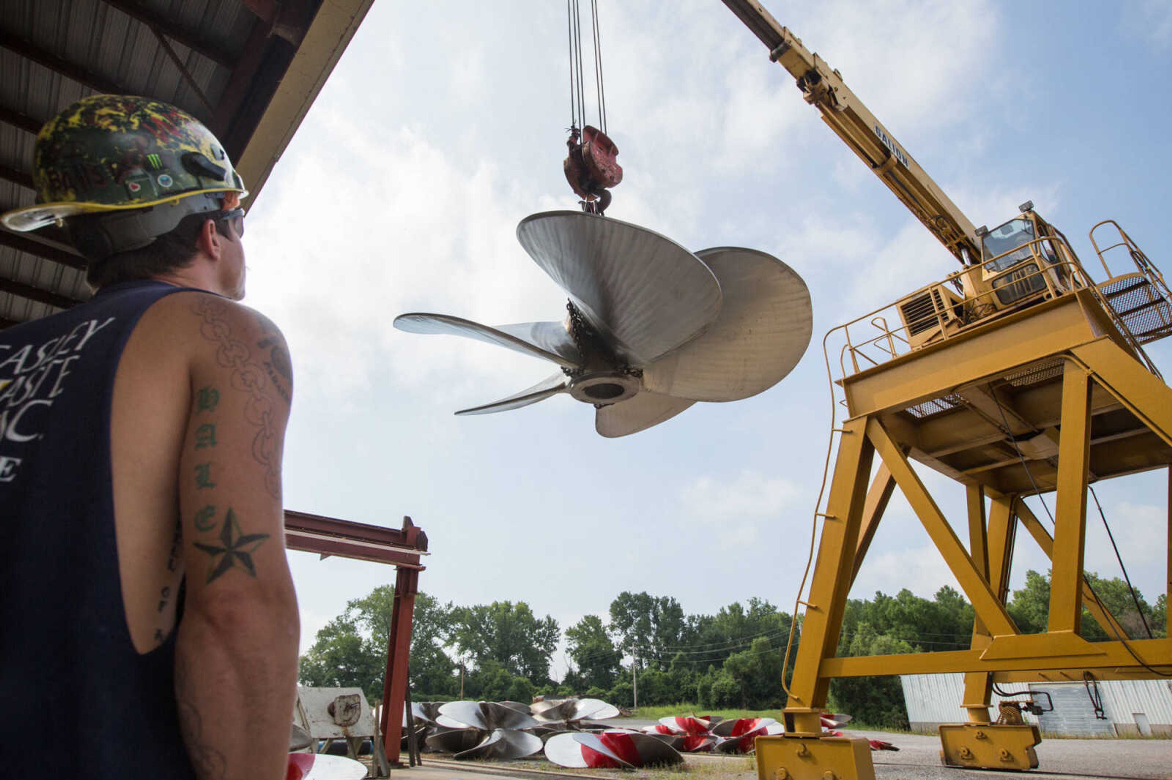 GLENN LANDBERG ~ glandberg@semissourian.com

Keegan Hale watches as Logan Farrenburg operates a crane to move propellers outside the repair shop at Missouri Dry Dock and Repair Co. in Cape Girardeau Wednesday, July 28, 2016.