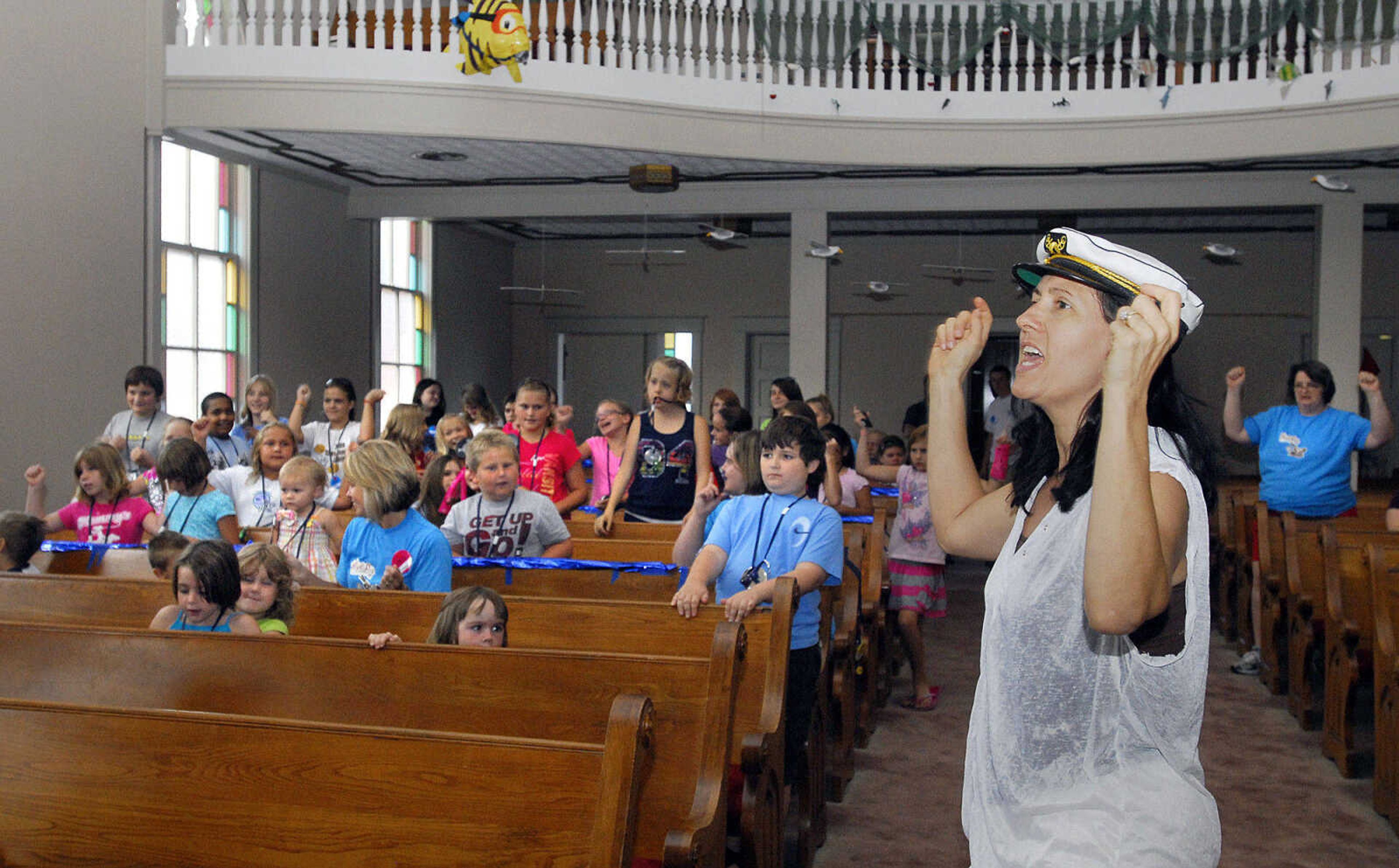 LAURA SIMON~lsimon@semissourian.com
VBS director at Eisleben Lutheran Church Heraleen Bowers leads children in a song Monday, August 2, 2010.