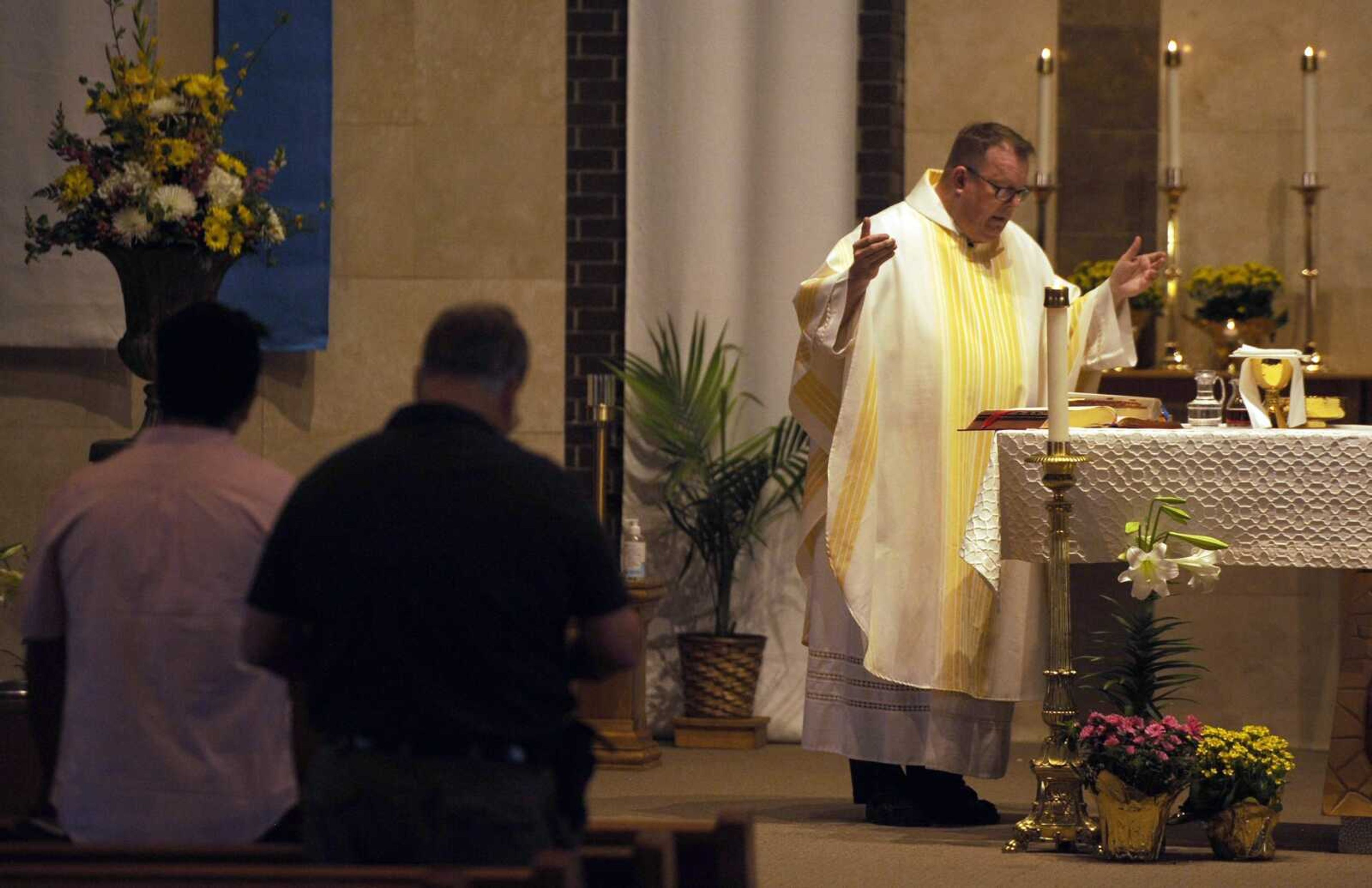 The Rev. Rick Jones celebrates Easter Mass on Sunday at St. Vincent De Paul Catholic Church in Cape Girardeau.