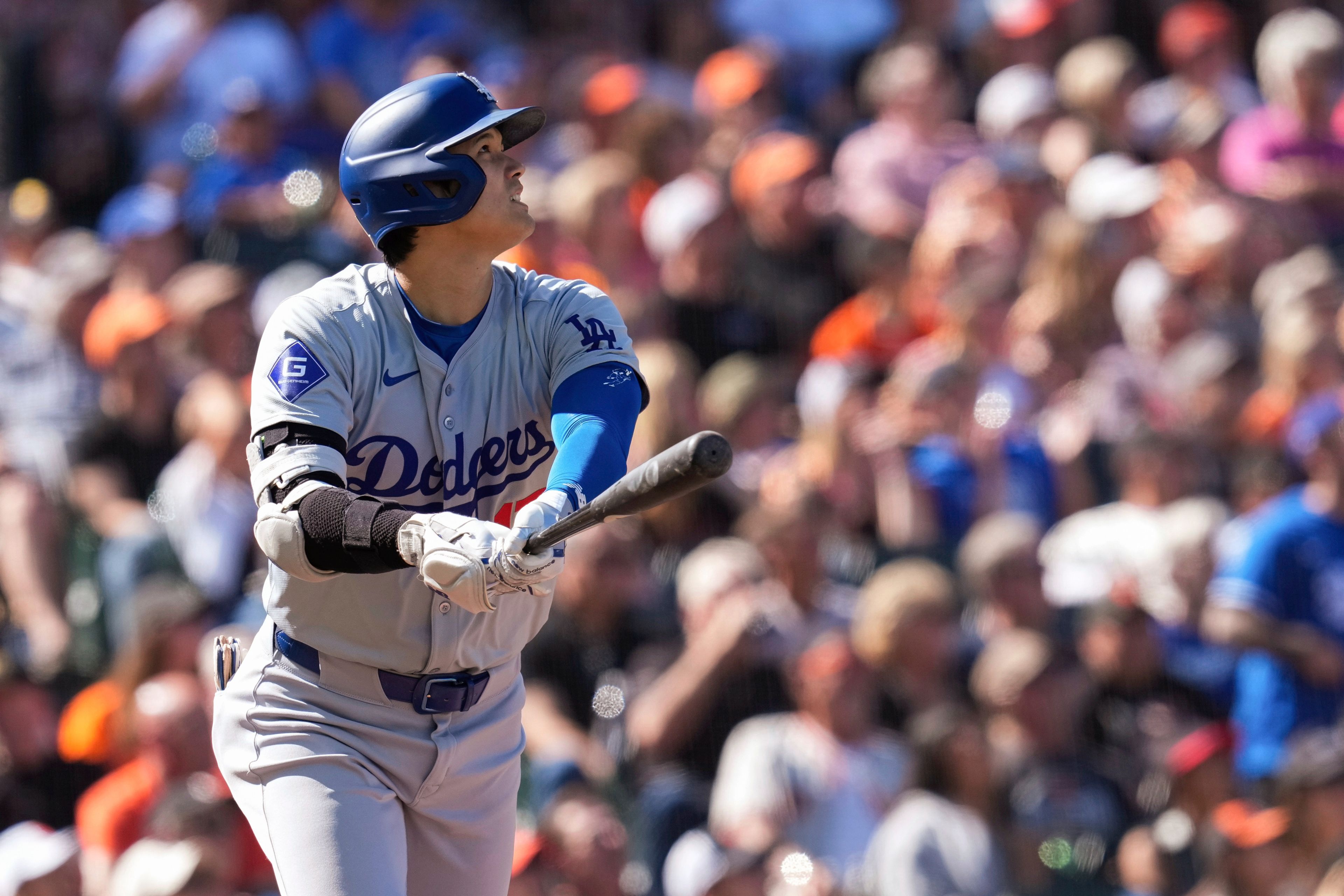 Los Angeles Dodgers' Shohei Ohtani watches his solo home run against the San Francisco Giants during the third inning of a baseball game Saturday, June 29, 2024, in San Francisco. (AP Photo/Godofredo A. Vásquez)